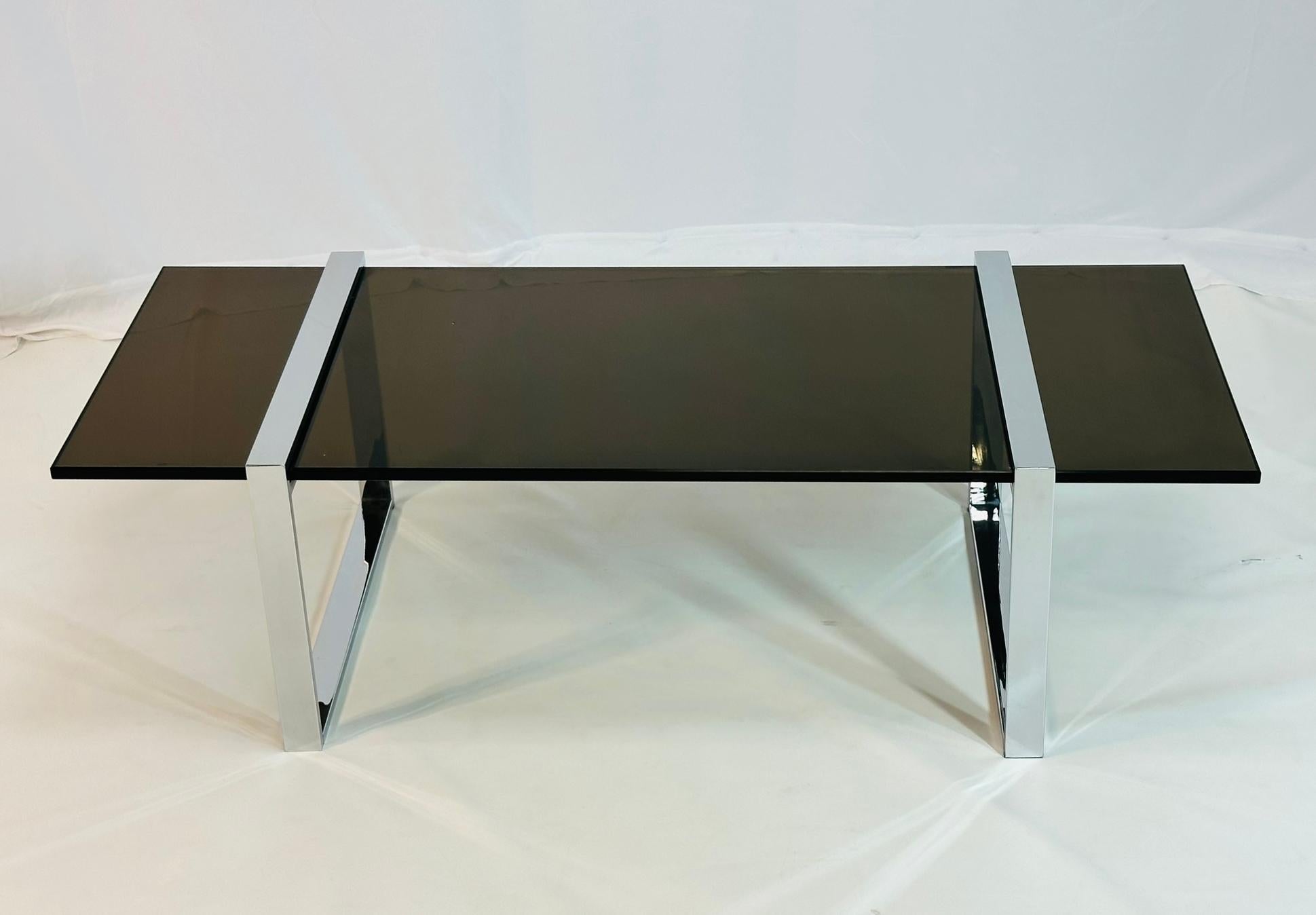 Enhance your living space with the timeless elegance of the Chrome & Glass 