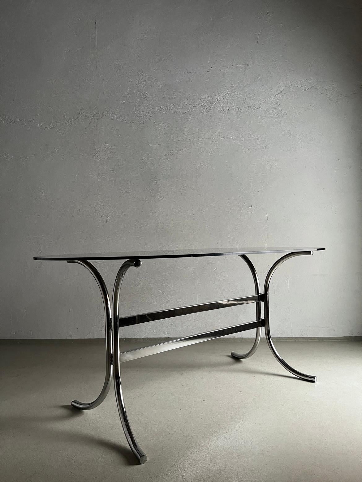 Vintage dining table with chrome base and smoked glass tabletop. My shipping option for the US includes only delivery of the metal base without the glass tabletop. For the Continental EU and UK - full set.

Additional information:
Country of