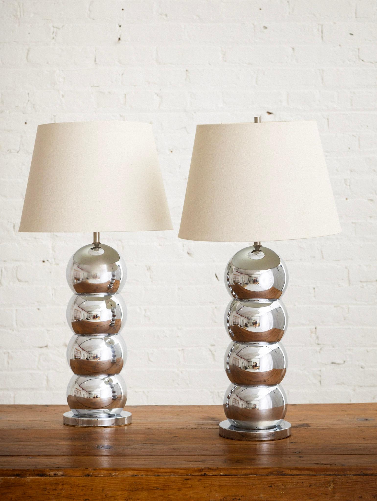 Pair of Mid-Century chrome stacked ball form lamps. Styled after George Kovacs’ “Caterpillar” lamp. Lamp shades not included.
Measurements are of each lamp including the harp and finial. Lamp without the harp measures 22.5“ high.