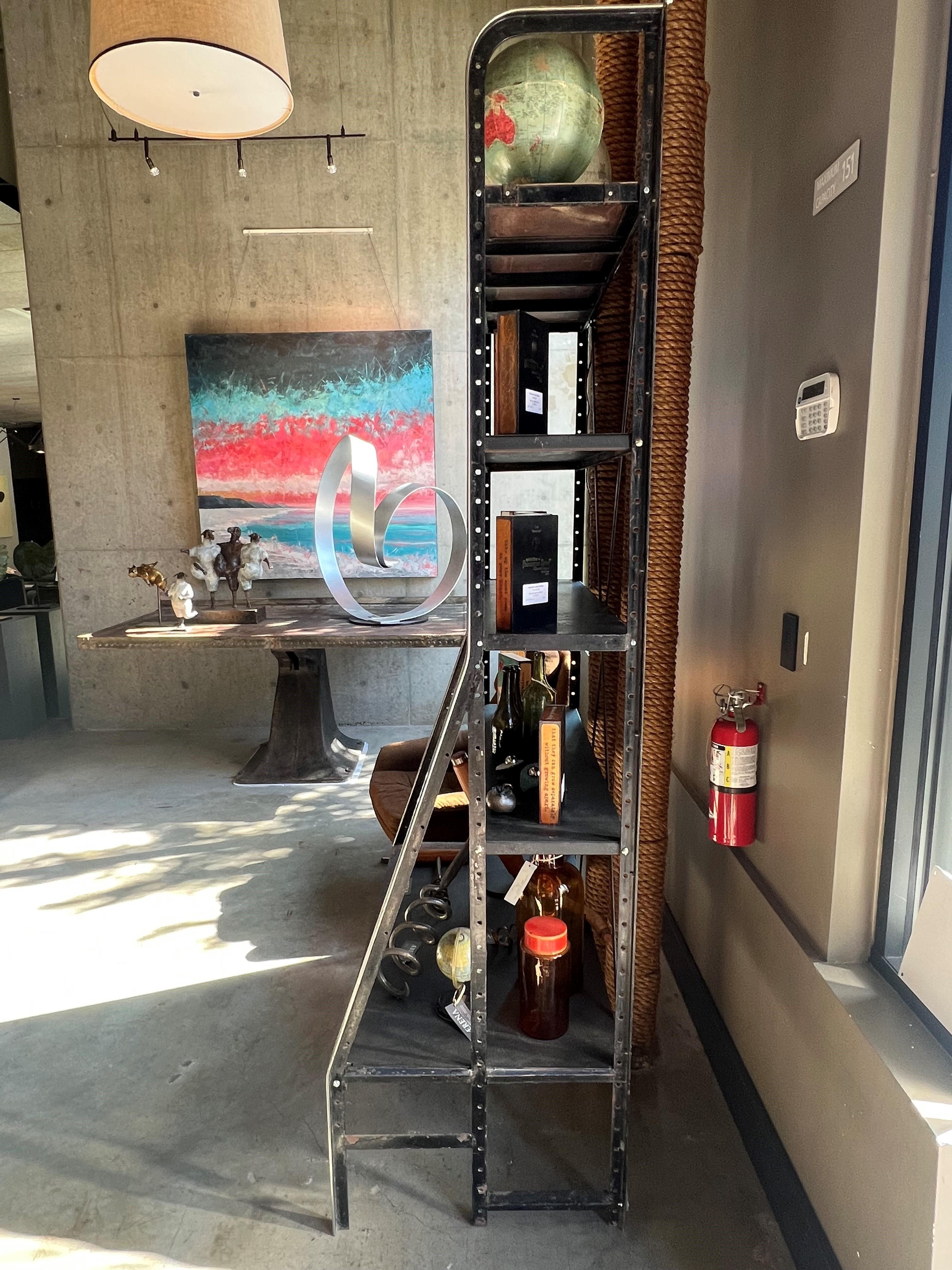 Mid-Century chrome and steel storage rack with a large bottom rack. Circa 1960 from the United Kingdom. 

This storage rack is in good condition for it's age and wear and can be used for displaying your sculptures, books, and antiques. 

The