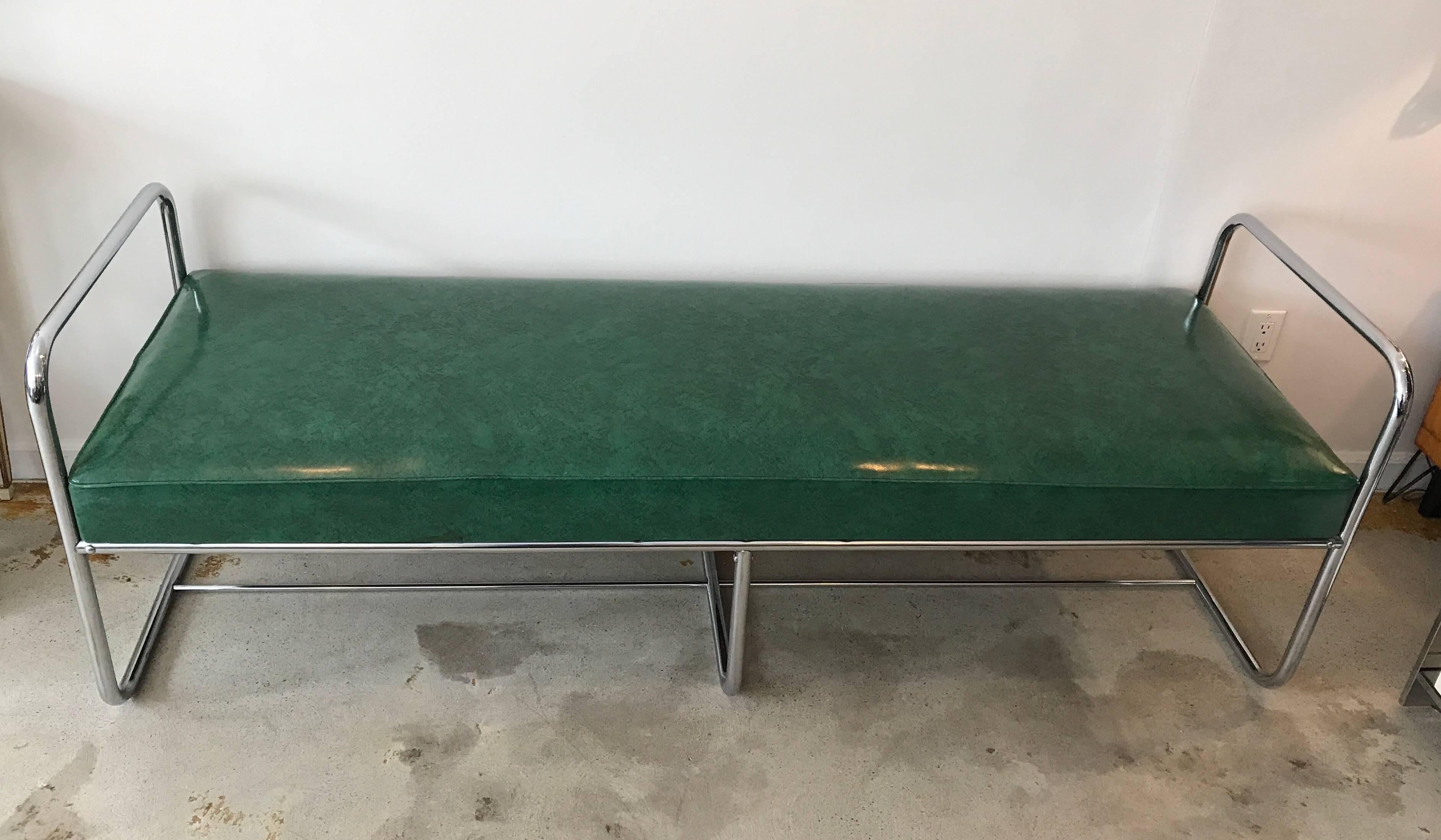 Awesome streamline moderne industrial bench with chromed metal tubular frame. All original green vinyl seating in great condition. This piece is consistent to the designs of KEM Weber, circa 1930s.