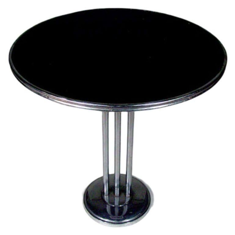 This versatile side table boasts a sleek chrome-tubular steel base adorned with decorative trim. Its adaptable size makes it a perfect fit as a center, lamp, end, or side table, ensuring functionality in various spaces. With its streamlined design,