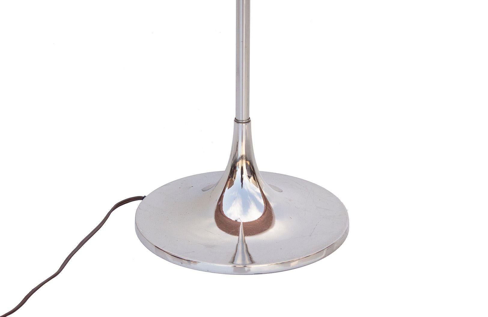 USA, 1960s
Chrome swing arm tulip floor lamp by Laurel Lamp Co. Signed LLC on the underside of the weighted base. Versatile floor lamp with adjustable swing arm. 
CONDITION NOTES: Original wiring is in working condition. Light age appropriate marks.