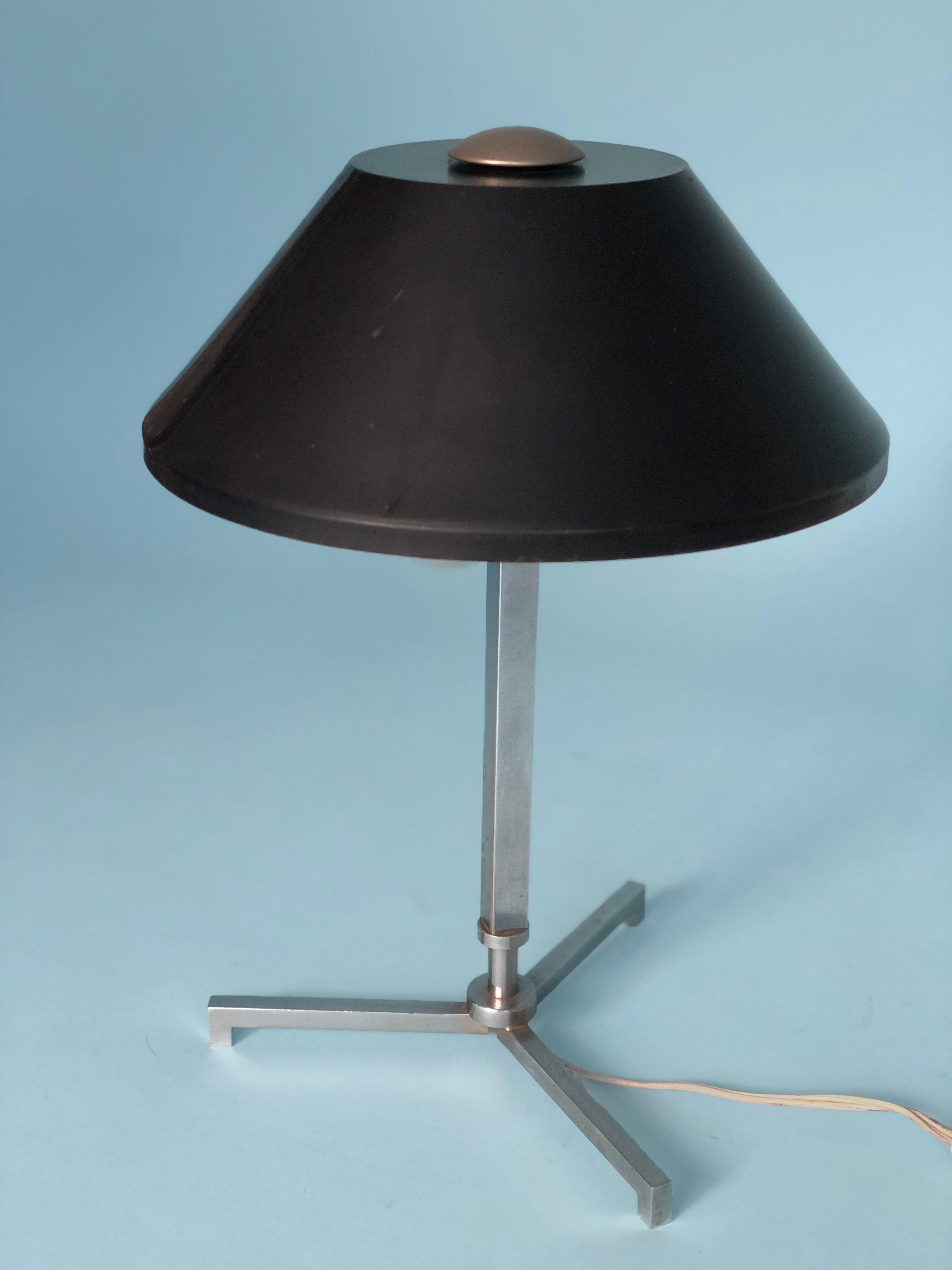 Chrome table lamp by Jo Hammerborg from Denmark 1960s. The lamp has 2 bulbs, a chrome 3 legs base and a metal black shade. In excellent vintage condition.

Designer: Jo Hammerborg for Fog & Mørup
Style: Mid century Modern
Period: 1960
Country
