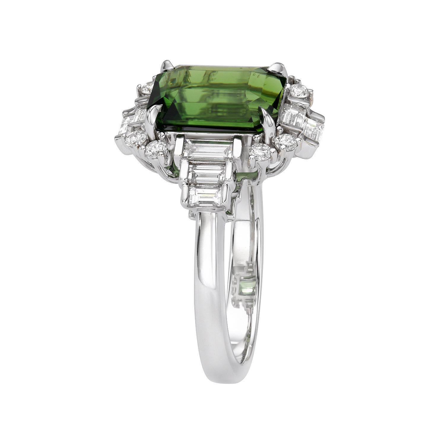 Rare and exquisite 3.15 carat Chrome Tourmaline Emerald Cut, 18K white gold ring, decorated with a total of 0.63 carat collection baguette diamonds and 0.16 carat collection round brilliant diamonds.
Ring size 6.5. Resizing is complementary upon