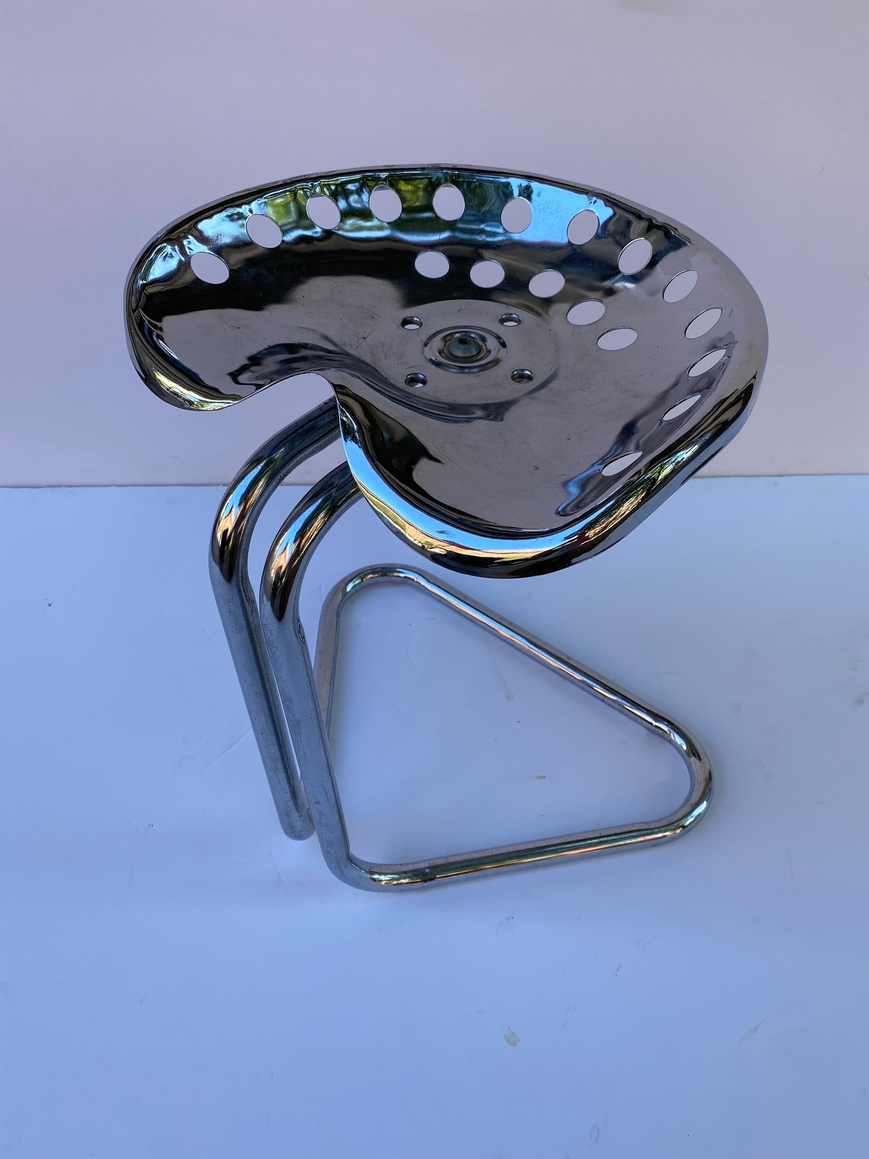 Unique Tractor seat stool. Chrome finish with a tubular triangular designed base and Tractor Seat. Sits sturdy! Nice accent piece to any room!.