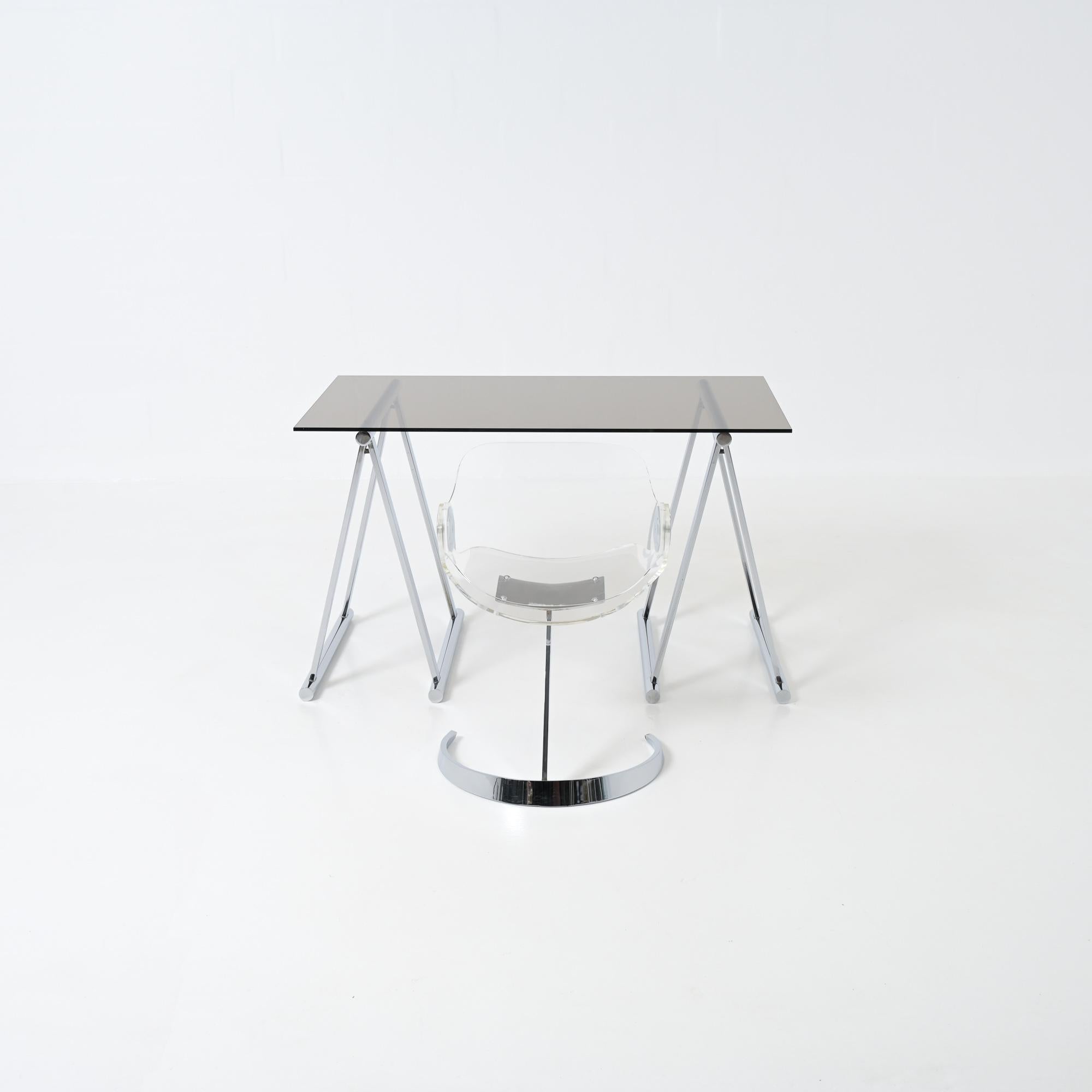 This chrome trestles desk came together with the Tabacof chair, they are a matching pair. The trestles are well made with sense for detail, definitely good quality. The glass top is in good condition without damage, there are signs of wear on some
