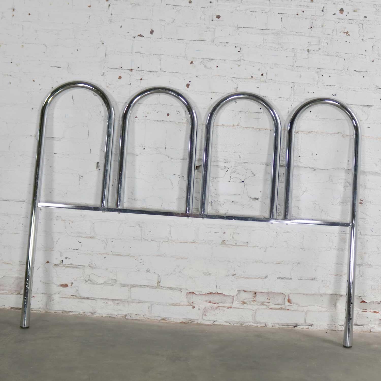 Handsome four arch chrome tube Mid-Century Modern full-size headboard. It is in wonderful vintage condition with normal wear. There are no outstanding flaws but only a few small nicks and scratches that can be found by looking closely. Please see