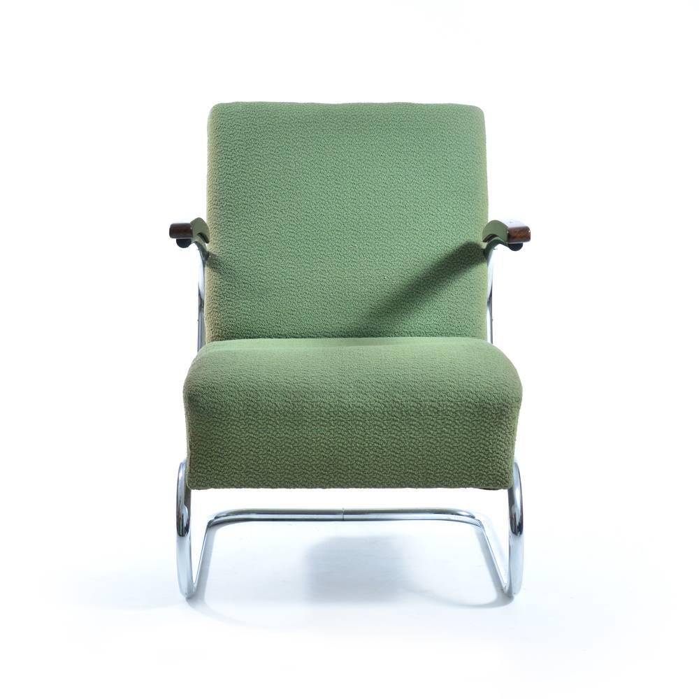 Iconic armchair type S411 on a chrome frame by Mücke Melder, designed in 1932. This pair was produced in 1940s. Original green fabric in very good condition with minor wear. One side of the chair shows minor sun fading of the color. Chrome in