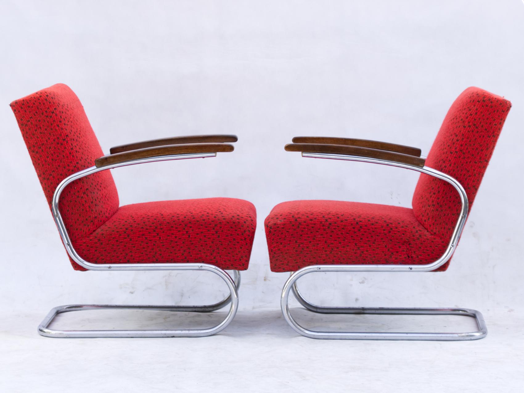 Pair of model armchairs, model S411 by Thonet circa 1930s Bauhaus period. Upholstery and nickel-plated tubular steel construction in original condition. The chrome at the bottom is lightly corroded in some places, but at its age they are in very