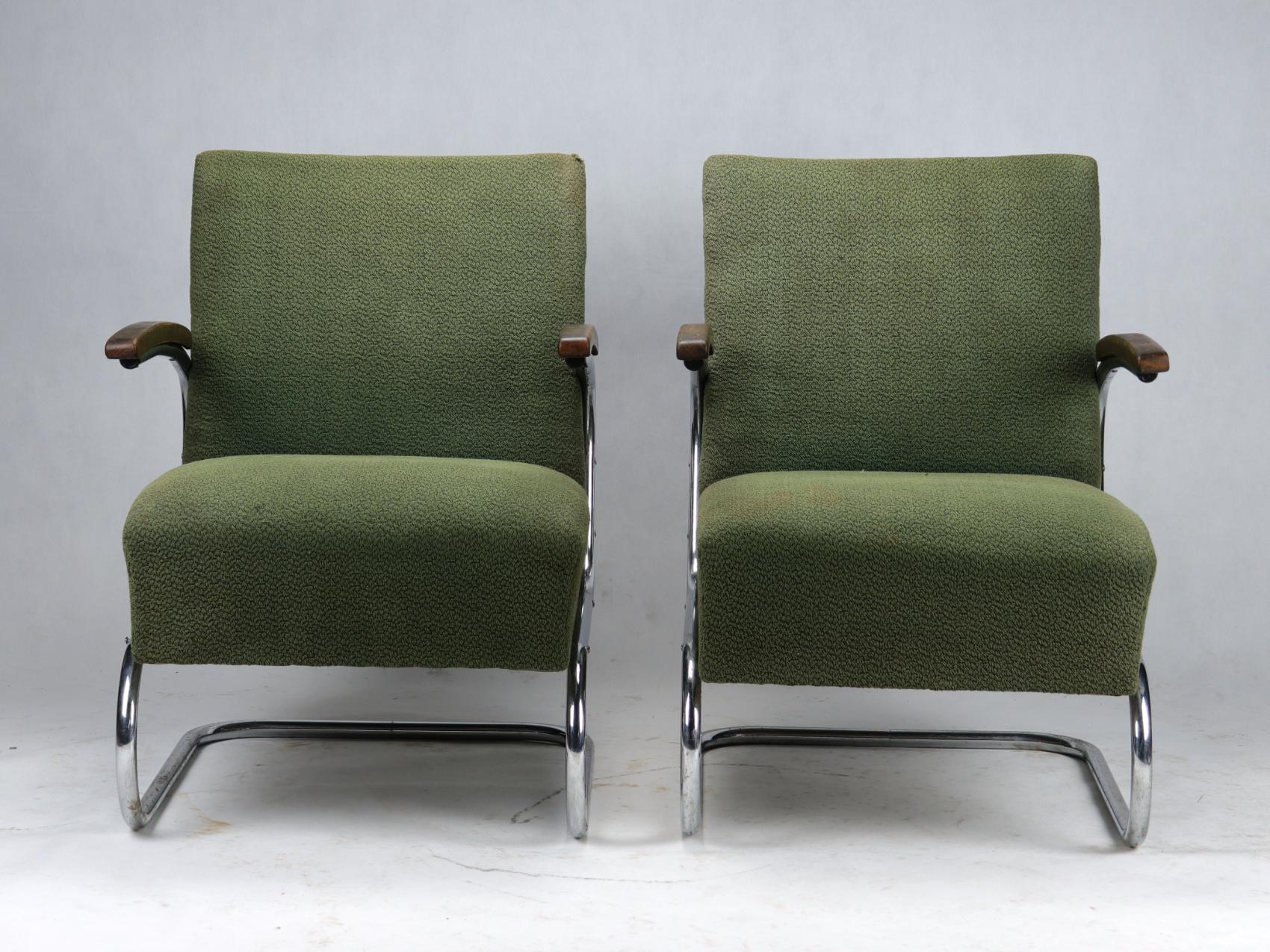 Pair of model armchairs, model S411 by Thonet circa 1930s Bauhaus period. Upholstery and nickel-plated tubular steel construction in original condition. The chrome at the bottom is lightly corroded in some places, but at its age they are in very