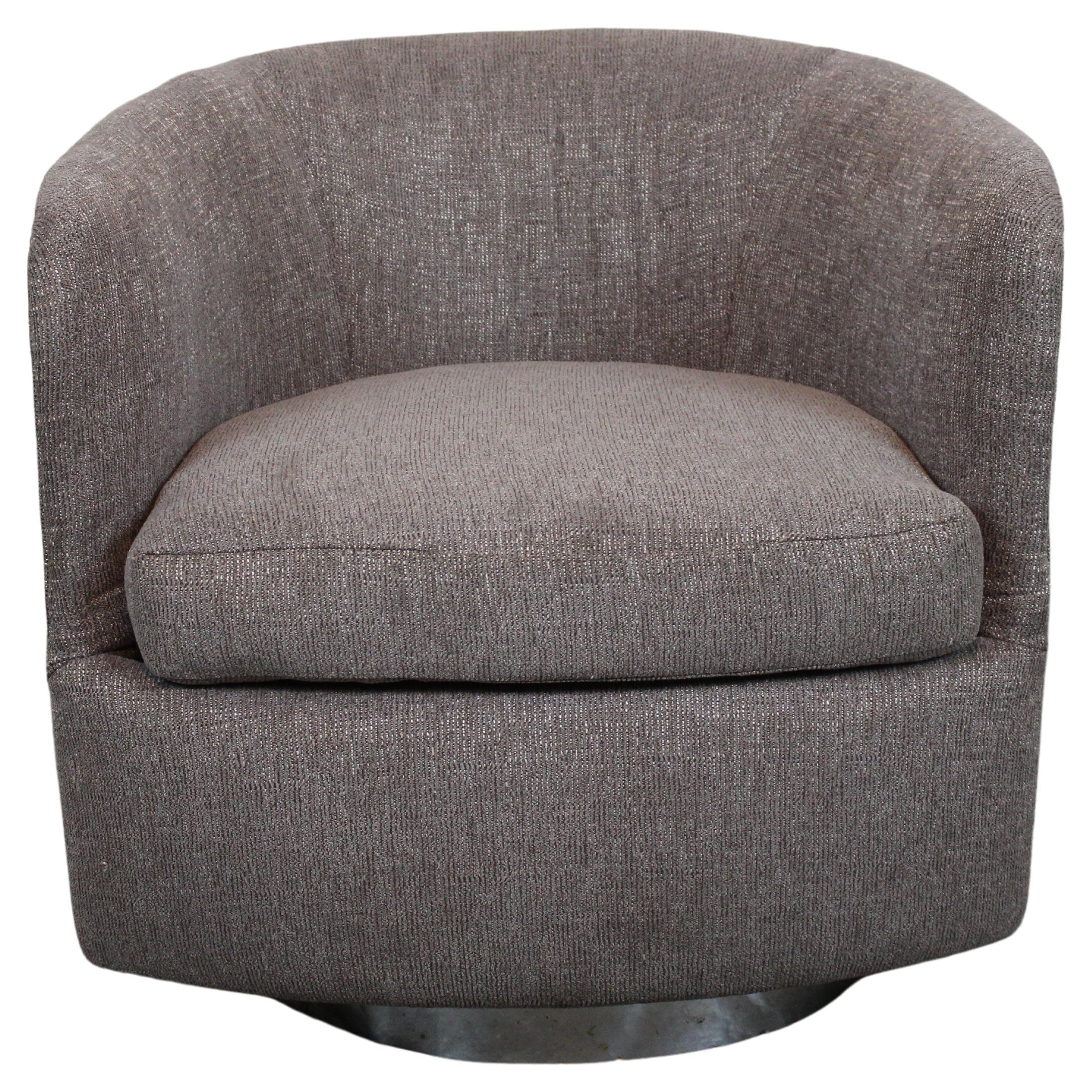 Take iconic mid-century American furniture for a spin with this classic tub chair from design legend Milo Baughman for Thayer Coggin of North Carolina. Featuring a wrap-around chrome covering and brand new reupholstery, this deep seated chair sits