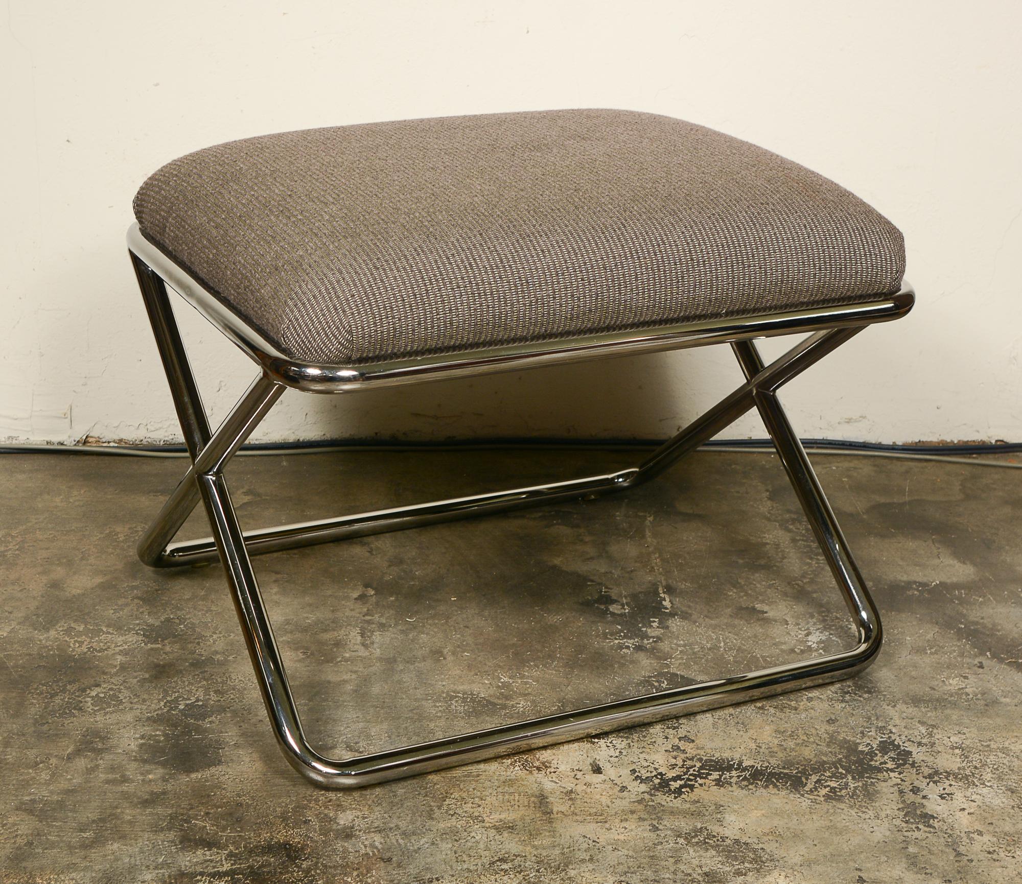 Ottoman or stool made by Swaim Originals of High Point, N.C. This was likely designed by John Mascheroni. This has a chrome plated X base. The construction of the stool is very high quality. The stool retains a Swaim Originals label. The upholstery