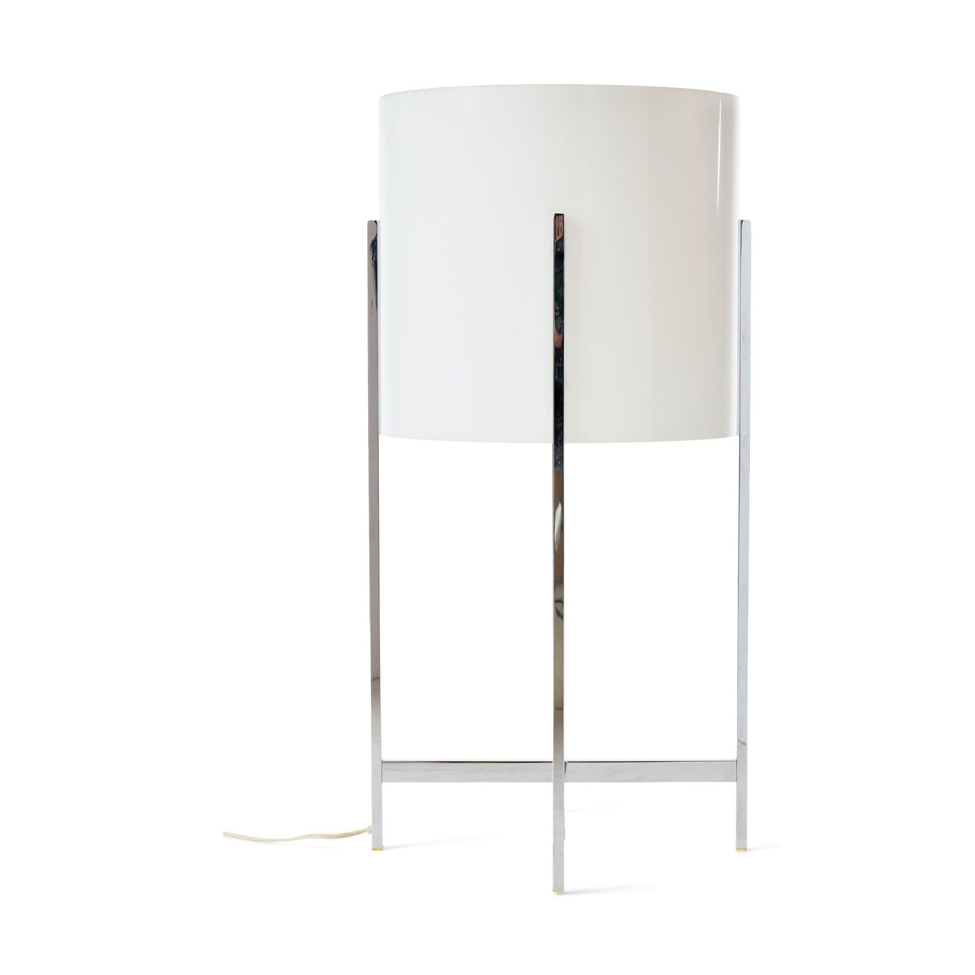 A chrome-plated brass and acrylic table lamp.