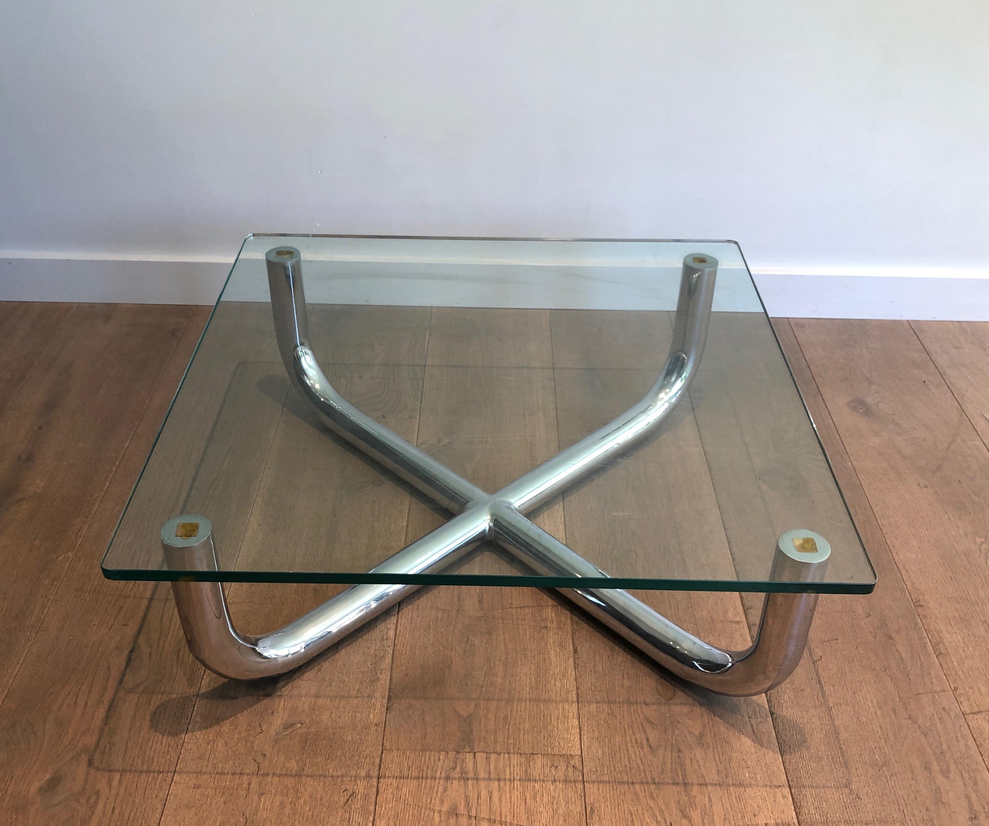 This coffee table is made of a chrome base with a glass shelf. This is a French Work. Circa 1970.