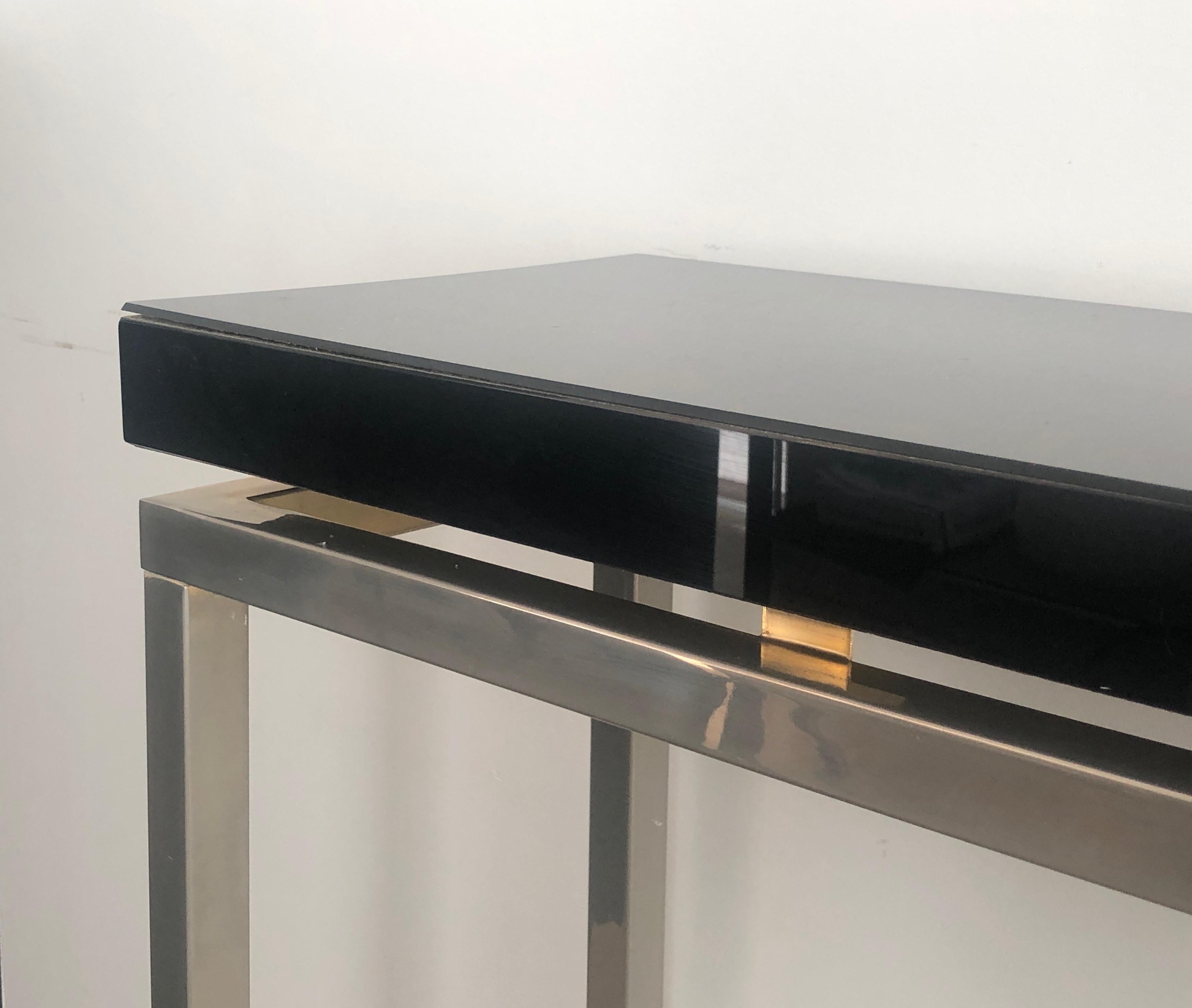 Chromed console with thick black lacquered top. French work. Circa 1970 For Sale 1