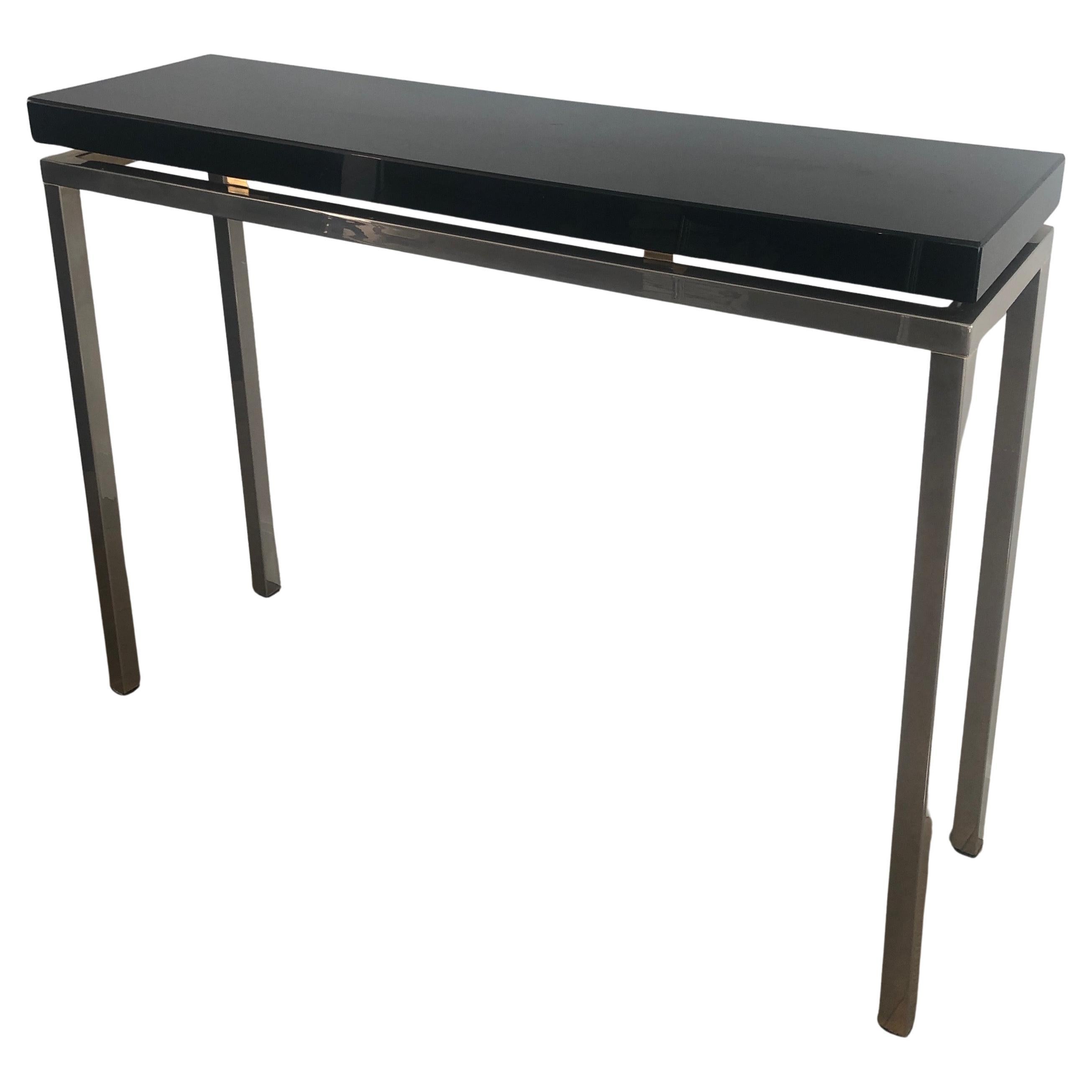 Chromed console with thick black lacquered top. French work. Circa 1970