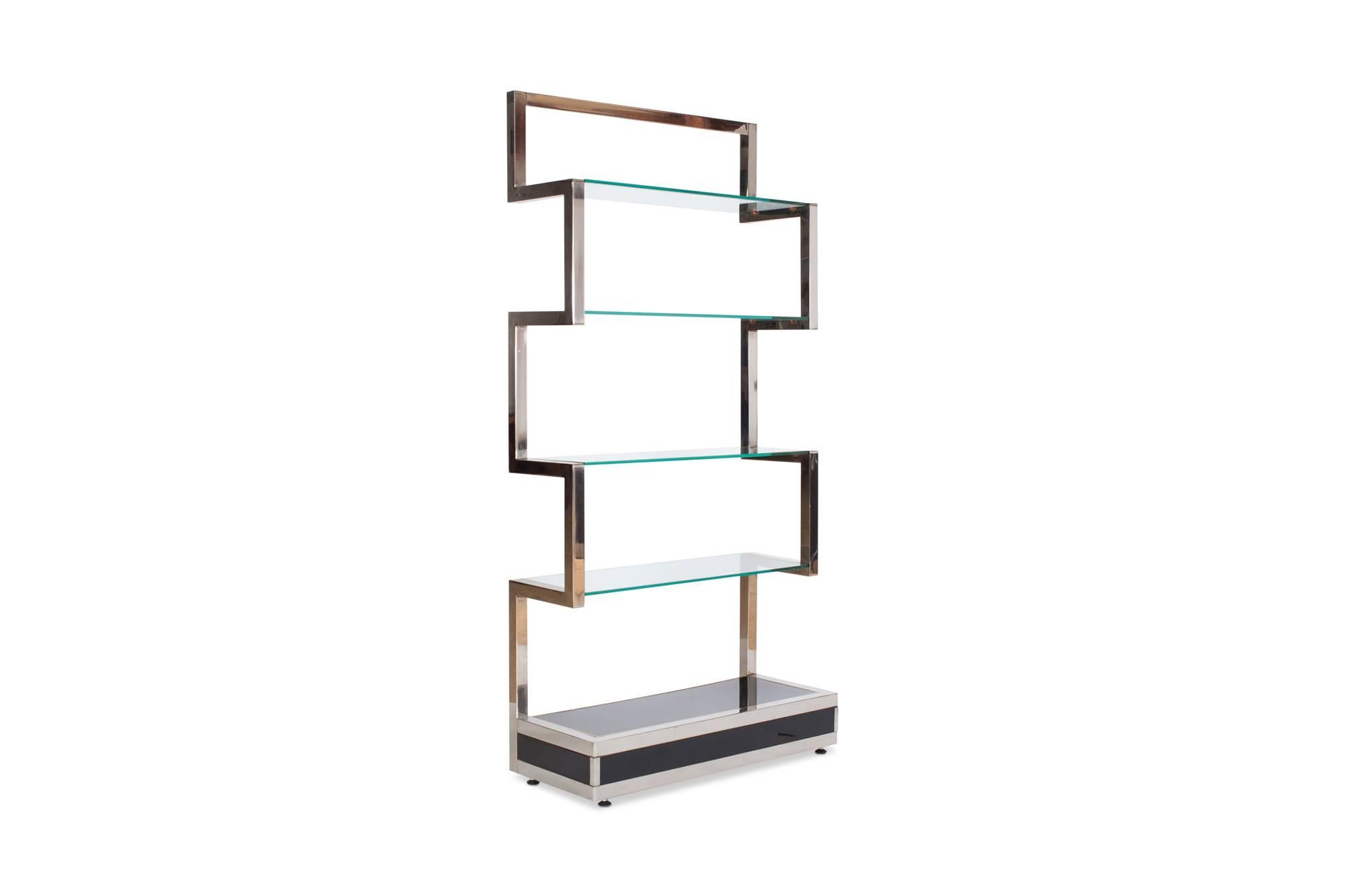 Chromed étagère by Belgo Chrome with clear glass shelving
A black lacquered base with geometrical sides in chrome

Highly decorative item

Belgium, 1980s

Measure: H 200 x W 76 cm x D 37cm.