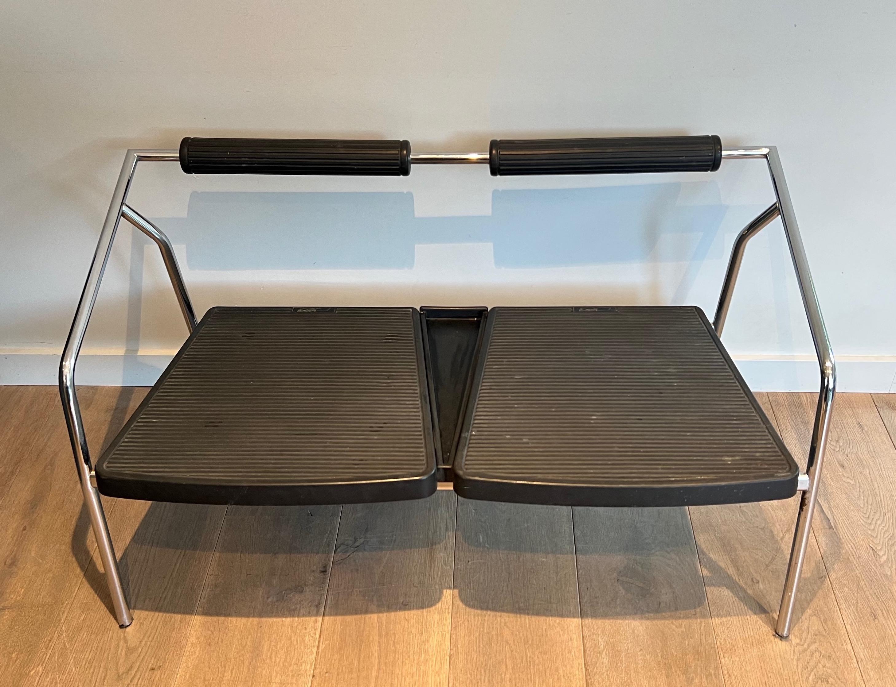 This unusual design sofa is made of chromed metal with black rubber back part and seat. This is a French work signed System. Circa 1970