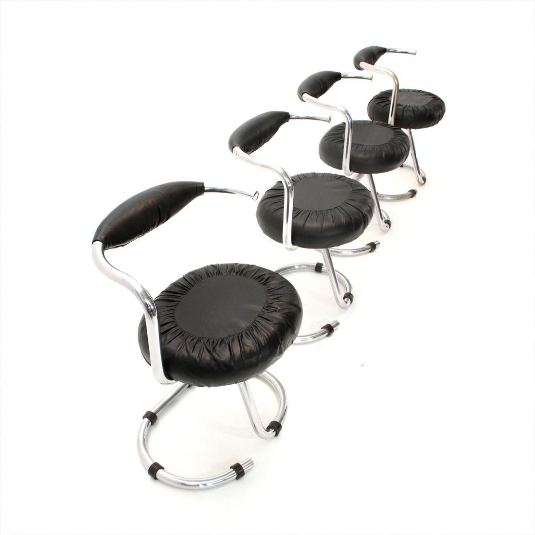 Four Italian 1970s manufacturing chairs designed by Giotto Stoppino.
Chromed metal frame
Black faux leather seat and back.
Good general conditions, some signs due to normal use over time.

Dimensions: Length 58 cm, depth 50 cm, height 77 cm,
