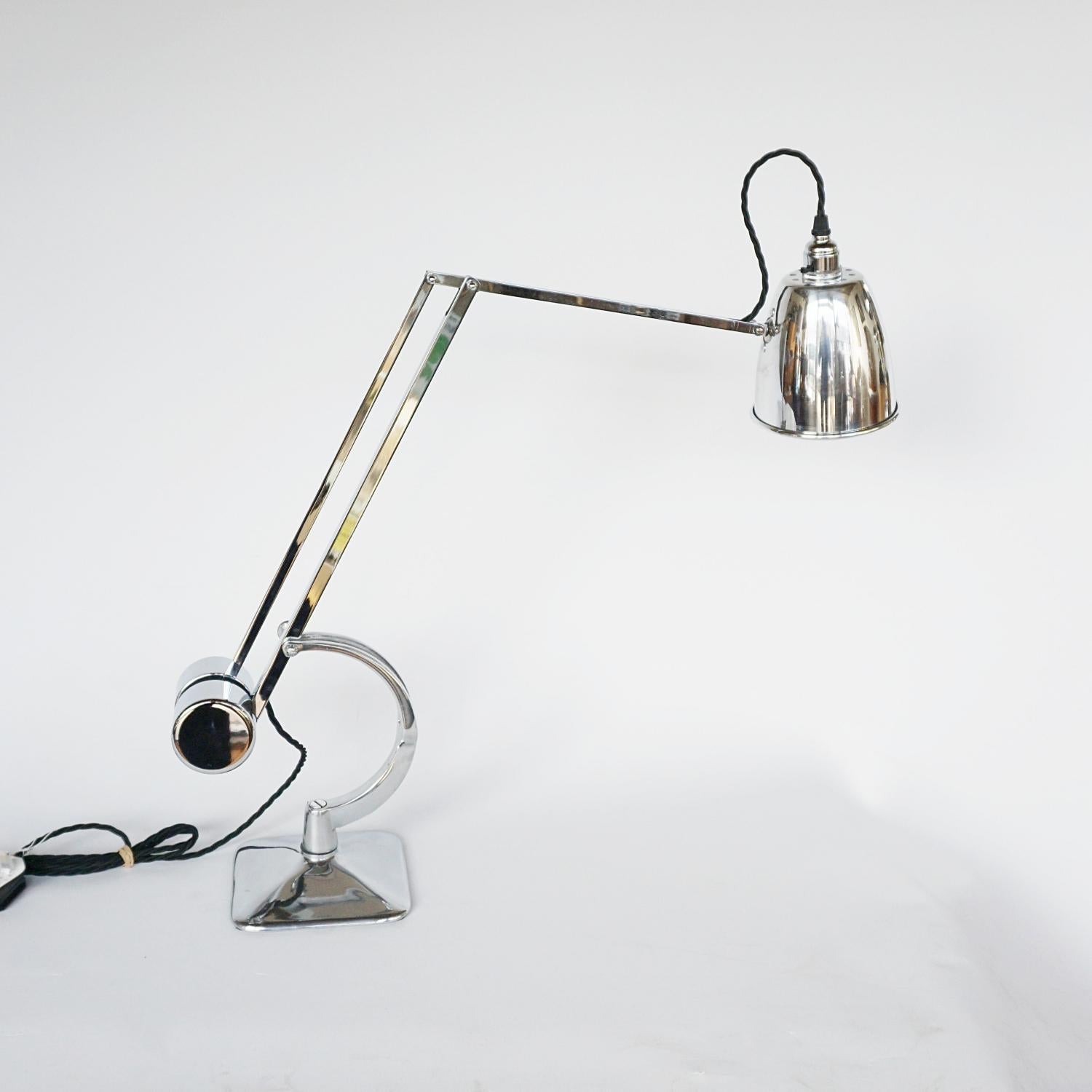 A chromed and polished metal counterpoise 'Roller' lamp by Hadrill & Horstmann. Original stamp to side. Barrel weighted counterbalance mechanism with a C-shaped fork.

Fully refurbished, re-wired and re-chromed. Some replacement