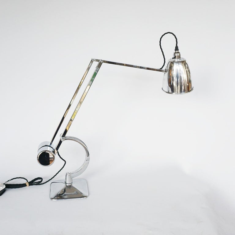 A chromed and polished metal counterpoise 'Roller' lamp by Hadrill & Horstmann. Original stamp to side. Barrel weighted counterbalance mechanism with a C-shaped fork.

Fully refurbished, re-wired and re-chromed. Some replacement