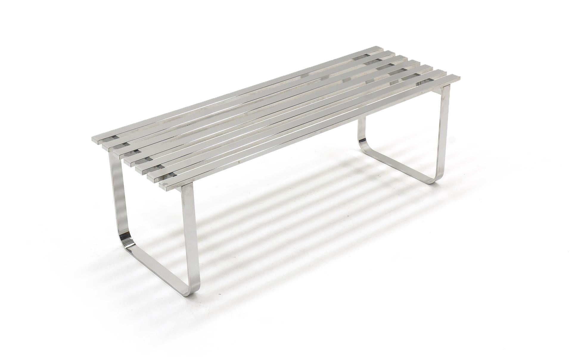 48 inch slat bench in chromed steel by Milo Baughman. Also makes an excellent coffee table. Minor surface scratches. Ready to use.
