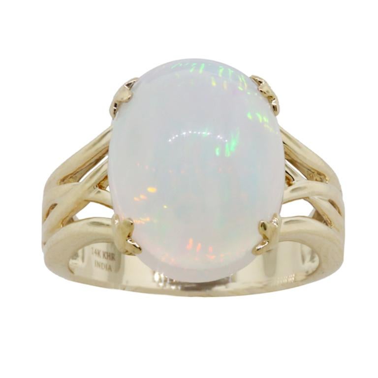 Celebra l'incantevole bellezza della natura con l'anello Chromia Ethiopian Opal, una squisita creazione progettata per catturare la luce, il colore e l'immaginazione. Al centro si trova un'ipnotica Opale etiope da 6,61 carati, rinomata per i suoi