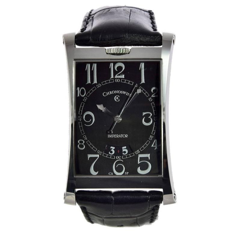 Case n° 08 098, Ref. CH2873. Made circa 2005

Rectangular stainless steel case, automatic movement, caliber 2892-2 ETA, 21 rubies, black dial, silver Arabic numerals, large date aperture at 6, sapphire crystal display, screw-down sapphire glass