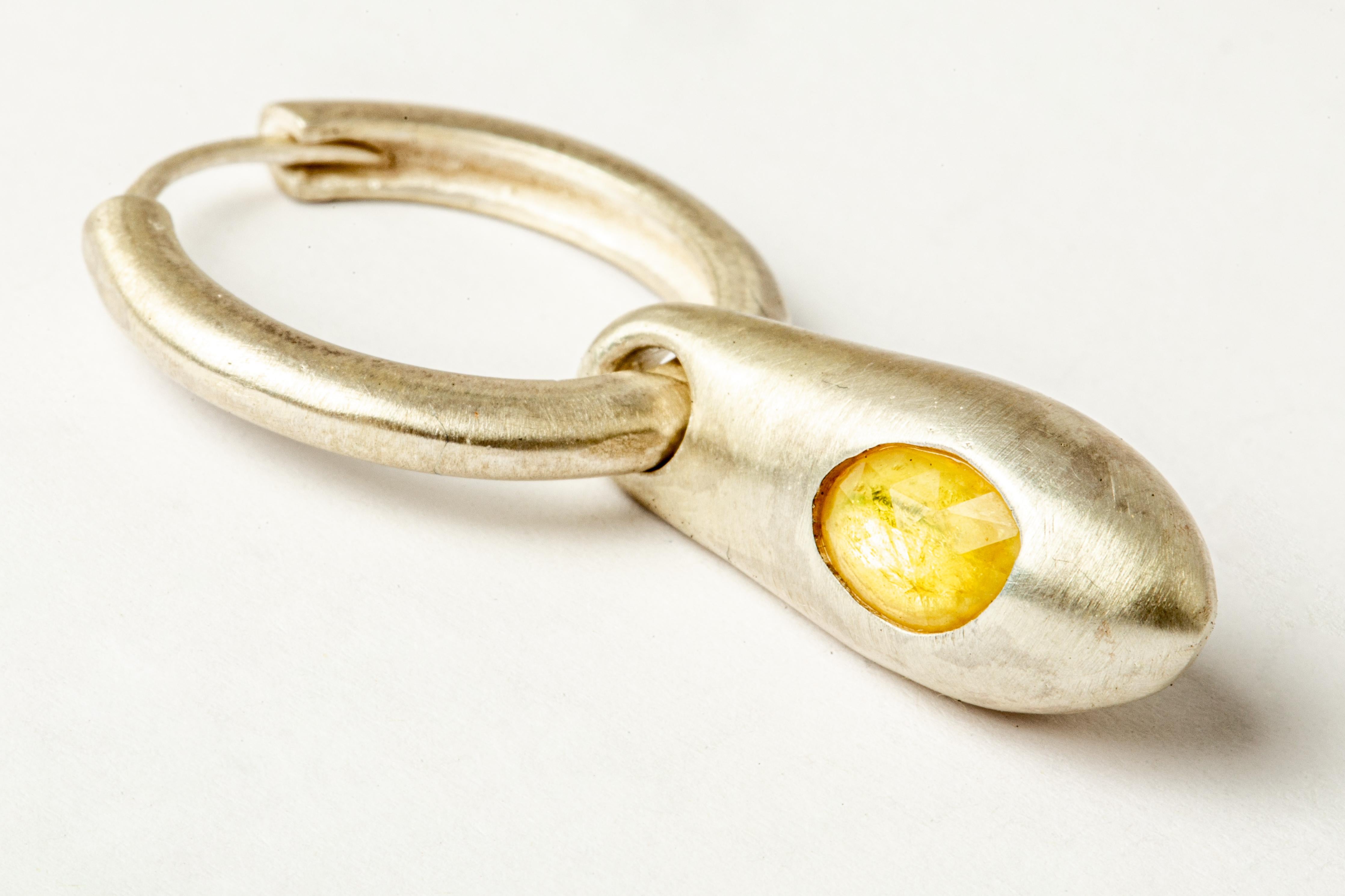Earring in the shape of a chrysalis in matte sterling silver with a slab of yellow sapphire. This item is made with a naturally occurring element and will vary from the photograph you see. Each piece is unique and this is what makes it special.
Sold