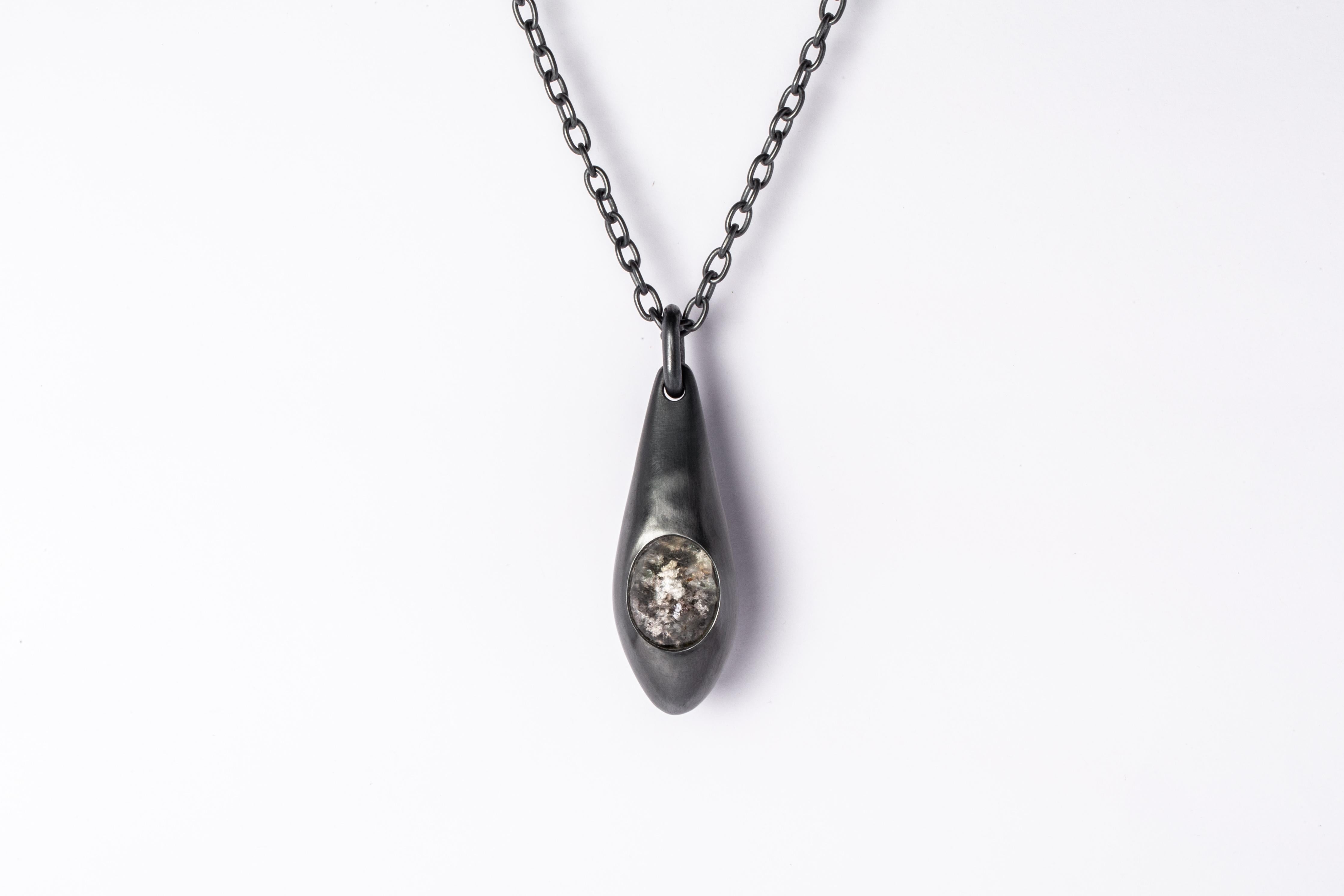 Necklace in black sterling and a rough garden quartz. Black Sterling is a surface oxidation of sterling silver. This finish may fade over time, which can be considered an enhancement. It comes on 74 cm sterling silver chain.
