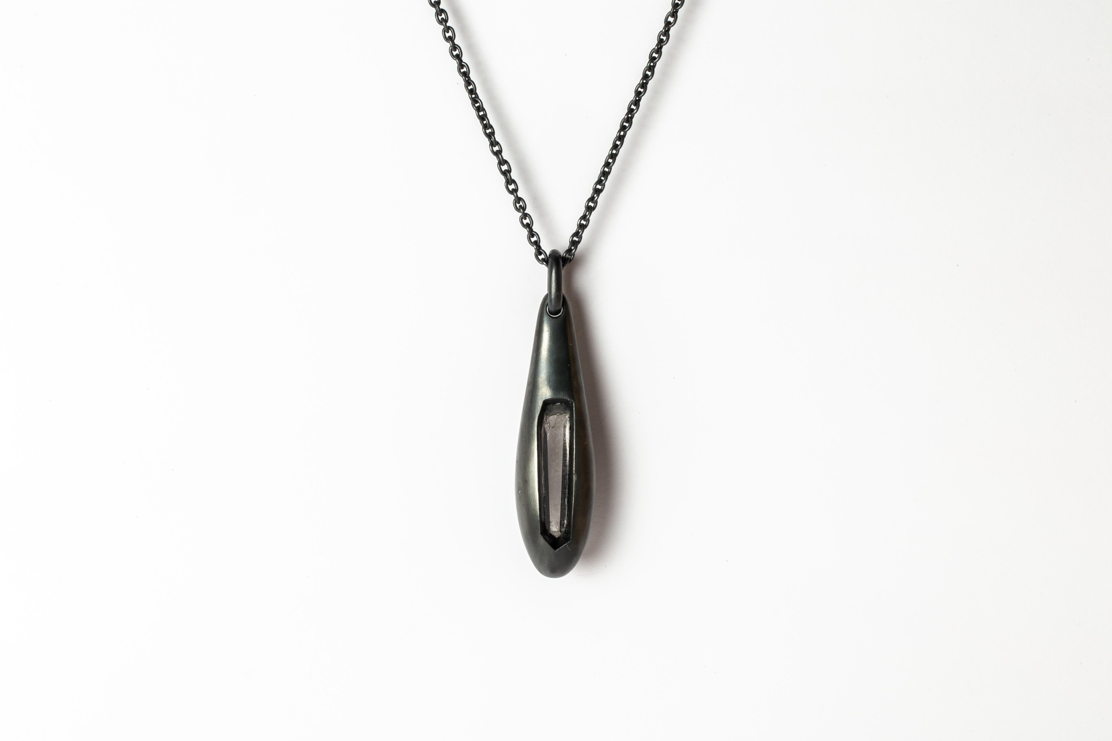 Necklace in the shape of chrysalis made in oxidized sterling silver and a slab of lemurian quartz. It comes on a 74 cm sterling silver chain. Each piece a unique and this is what makes it special.