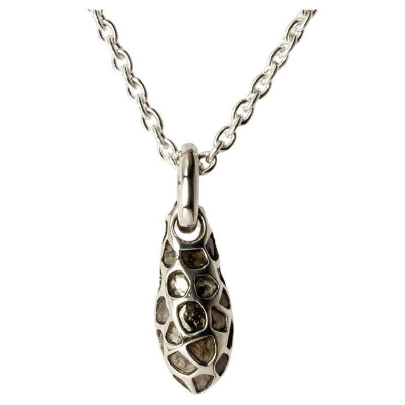 Drop necklace in the shape of a chrysalis in polished sterling silver and slabs of rough diamond set in mega pave setting. It comes on a 74cm chain. These slabs are removed from a larger chunk of diamond. Each piece is unique and this is what makes
