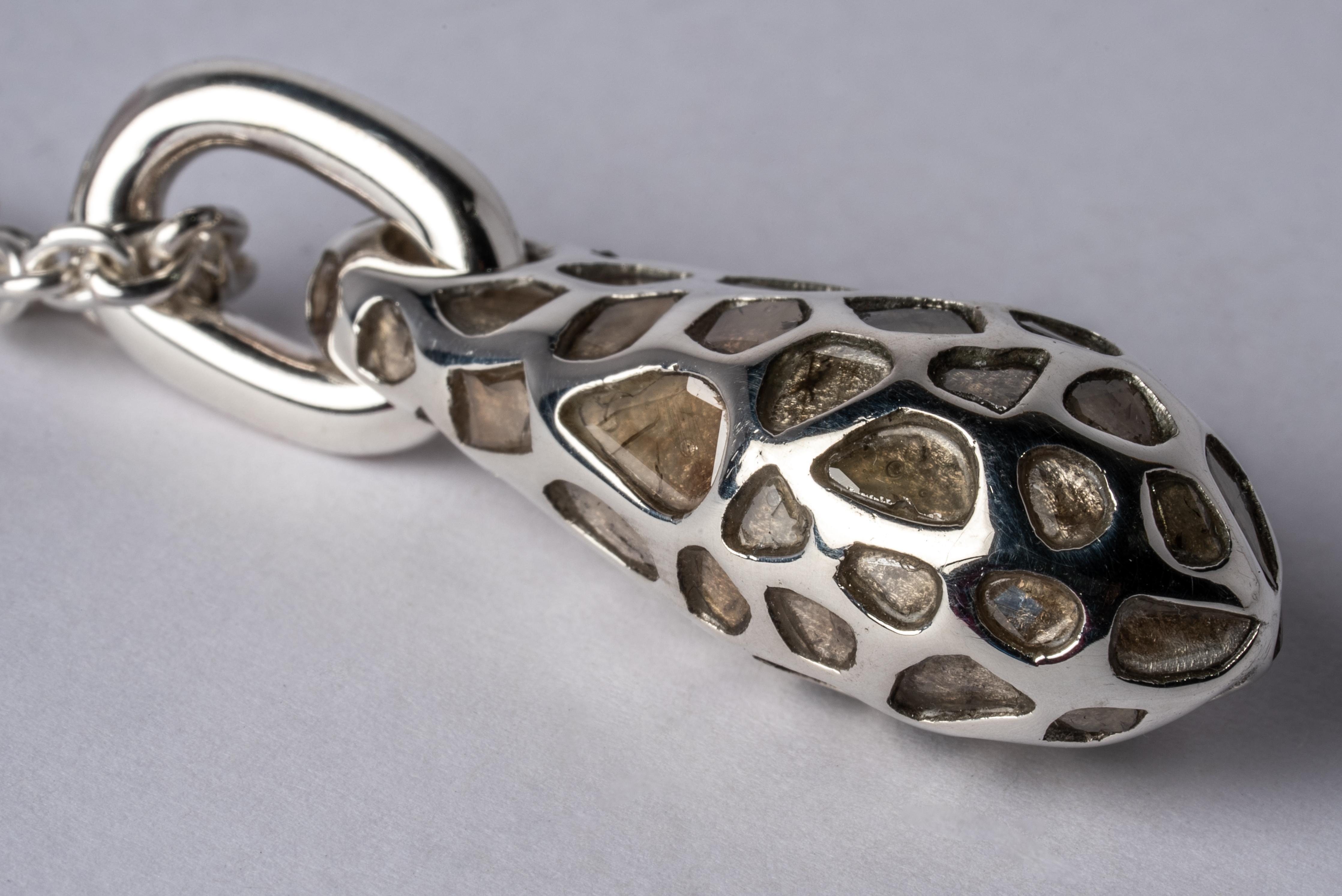 Pendant necklace in sterling silver and slabs of rough diamond set in mega pave setting. These slabs are removed from a larger chunk of diamond, it comes on a 74cm chain. This item is made with a naturally occurring element and will vary from the