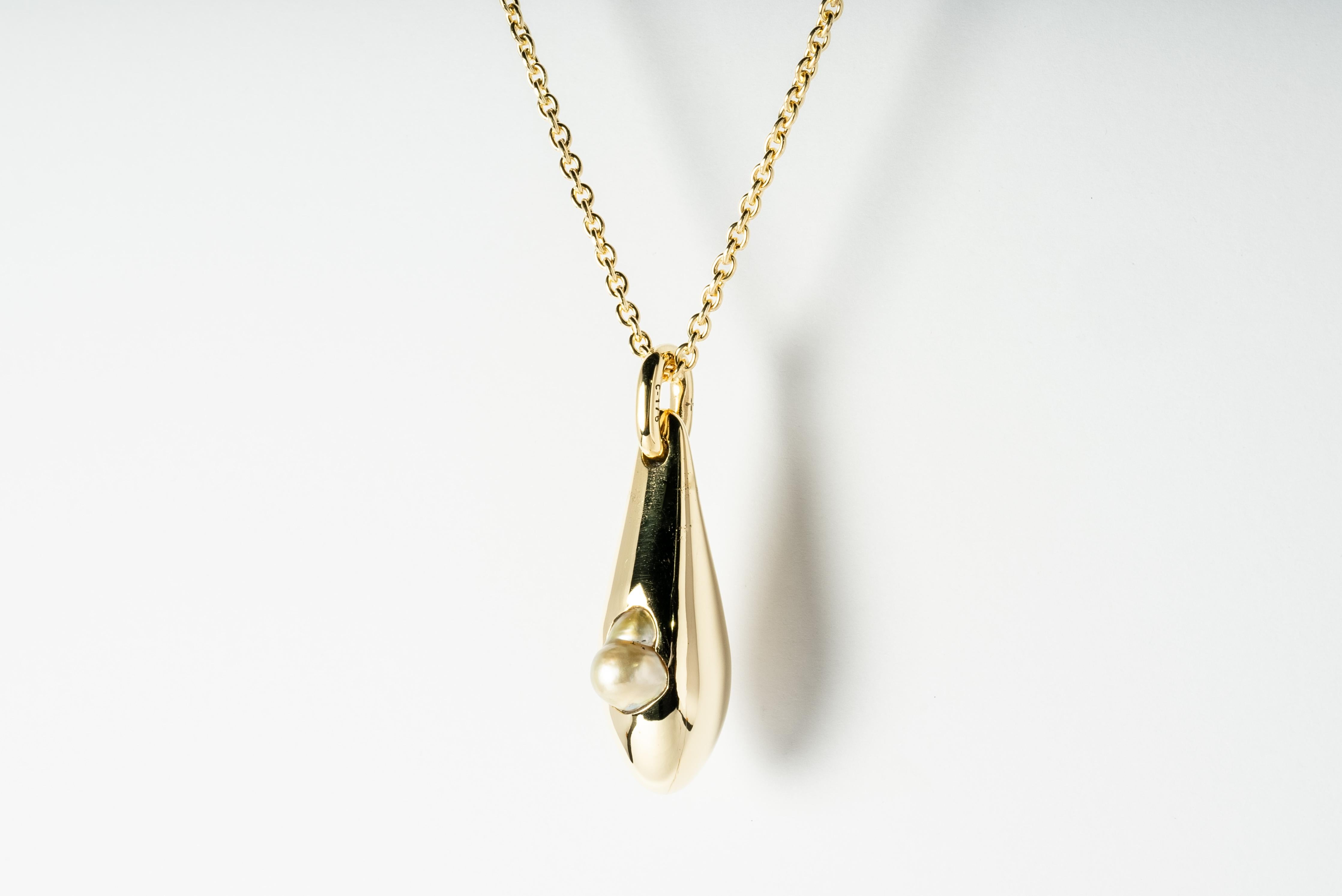 Necklace made in brass, sterling silver, and a golden pearl. The brass and sterling silver are substrate, polished, and electroplated with 18k gold. The golden pearl is a rare specimen of a baroque tear-dropped saltwater pearls. This is wild and