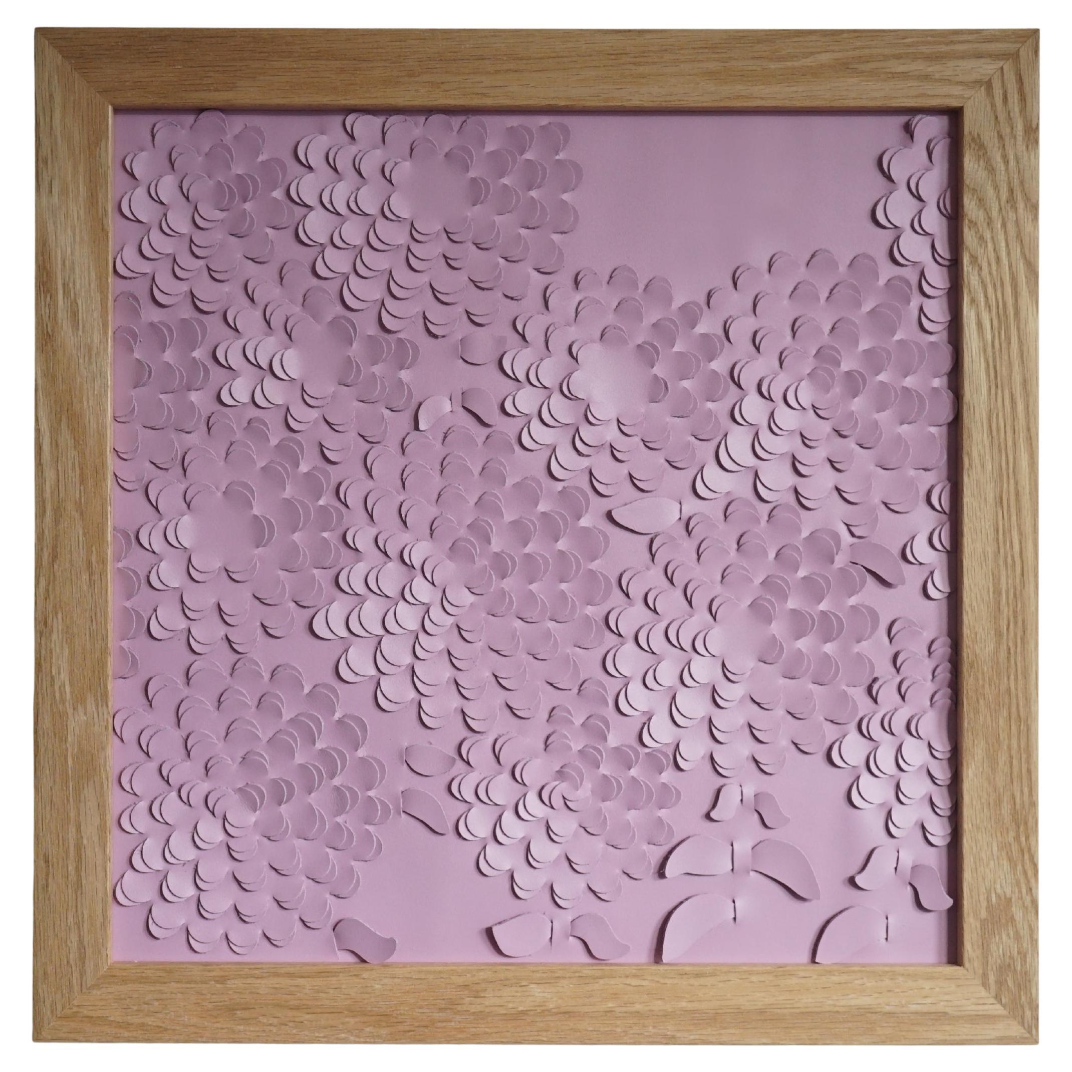 Chrysanthemum:

A piece of 3D sculptural wall art designed and made from two layers of pink leather, woven together by Louise Heighes.
Measurements are 17 x 17 inches or 43 x 43 cm

This piece is inspired by the big mass of repeating petals of the
