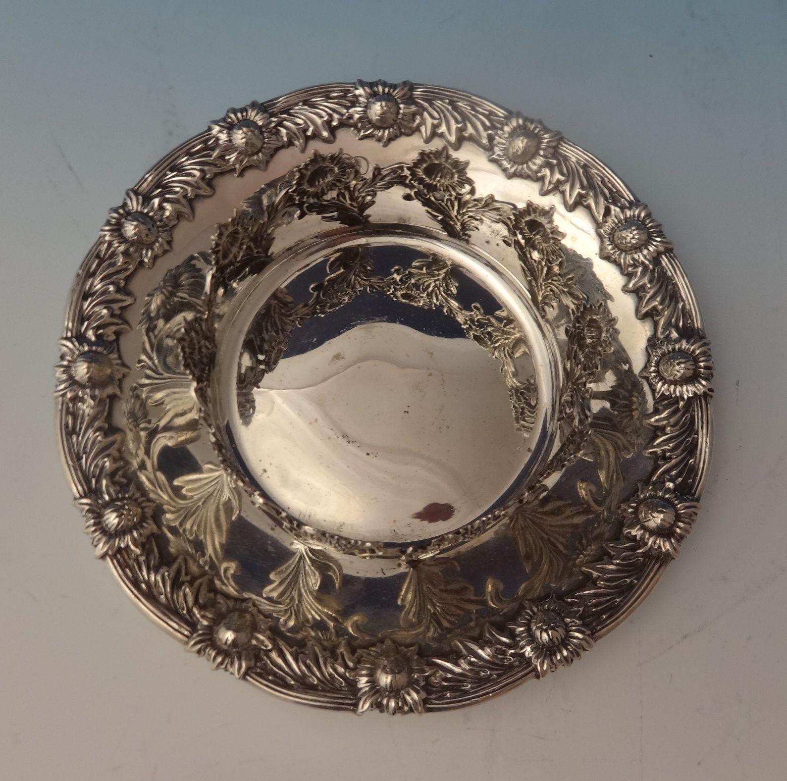 Superb Chrysanthemum by Tiffany & Co. sterling glass holder with attached coaster and glass insert. It is marked #15368/8068 and it's stamped with the letter C date letter for 1902-7. The measurements for the piece are 1 1/4 tall, with the glass