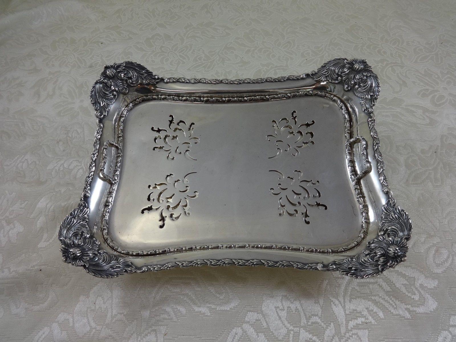 Superb Chrysanthemum by Tiffany & Co. sterling asparagus tray with pierced chrysanthemum scroll-work insert. The corners and feet feature large chrysanthemums. The piece is stamped with a C date mark for 1902-7 and #13372/1915. The measurements for