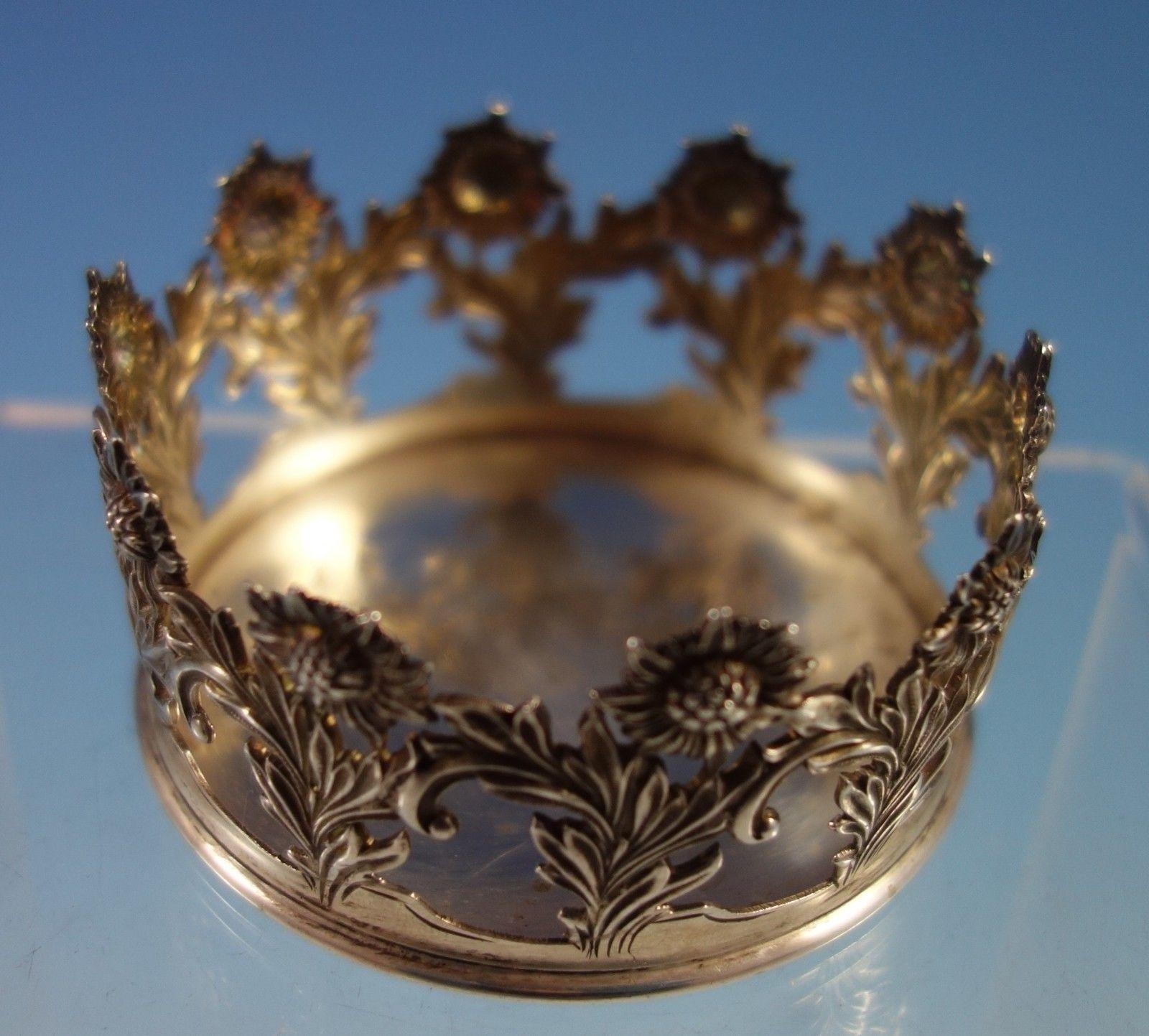 Chrysanthemum by Tiffany & Co. sterling silver base that could be used either for a vase or cup. The piece is marked with #15563/5735 and C date mark for 1902-1907. The base measures 2 7/8 in diameter, and it weighs 2.33 ozt. It is not monogrammed