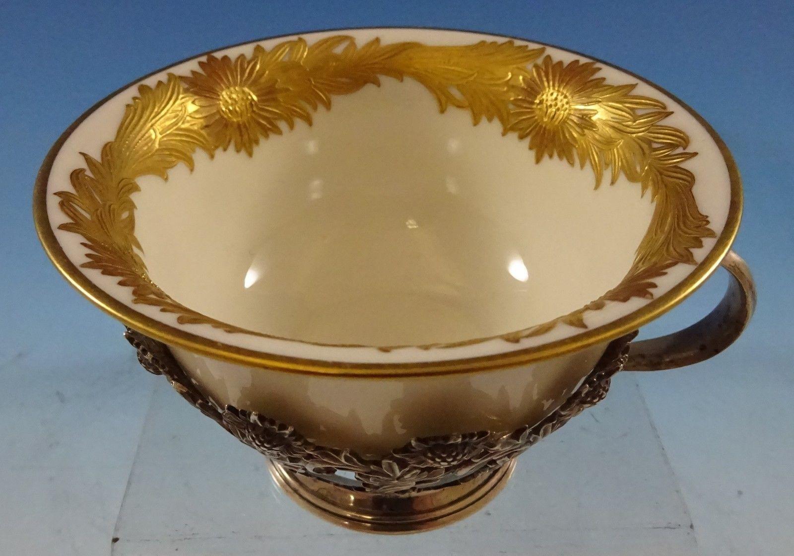 Chrysanthemum by Tiffany & Co.
Stunning Chrysanthemum by Tiffany & Co. sterling silver tea cup with gorgeous gold chrysanthemum Lenox liner. The piece measures 4 1 7/8 and weighs 2.22 troy ounces. It is not monogrammed and is in excellent condition.