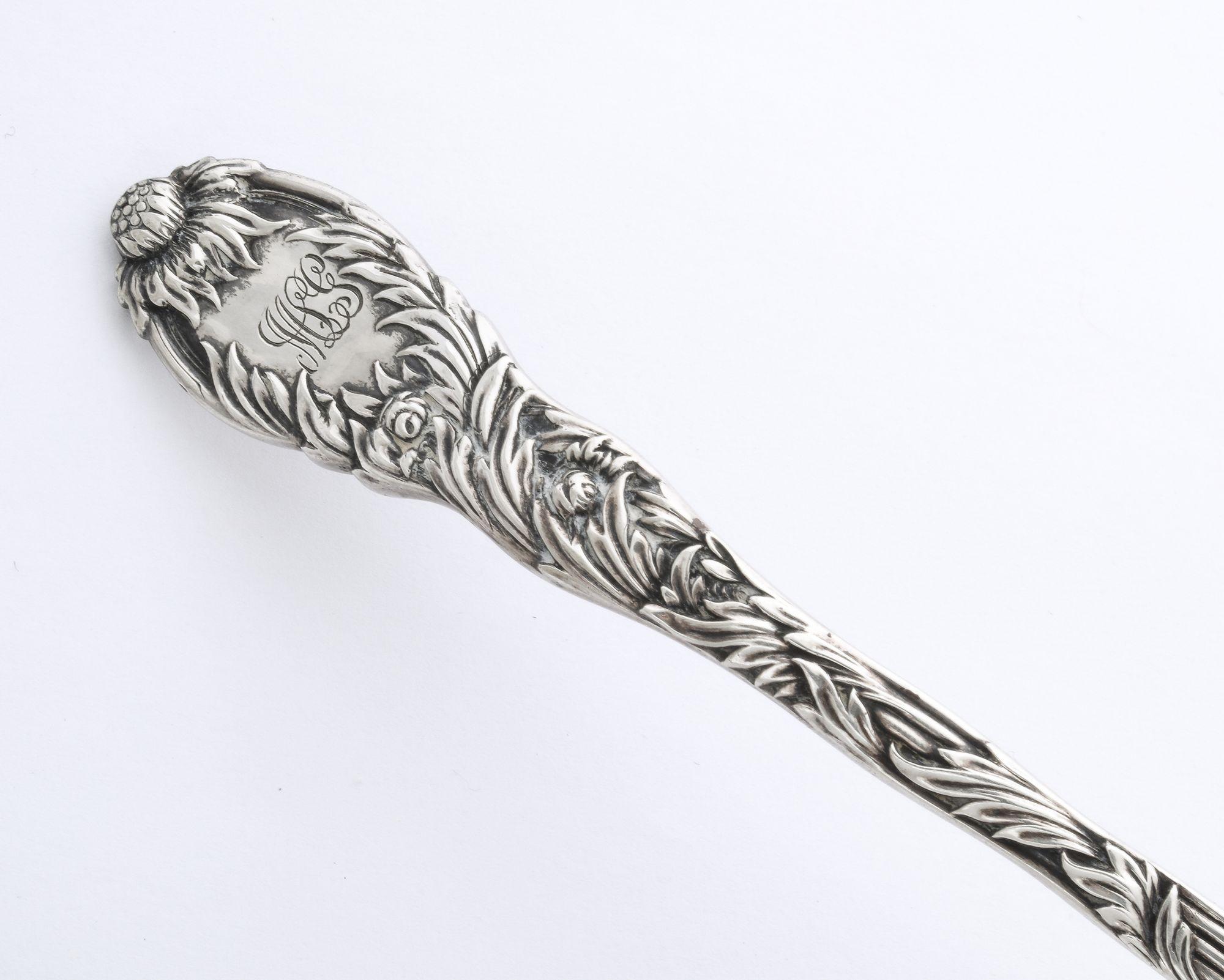A wonderful sterling silver claret ladle Chrysanthemum (circa 1880) Tiffany's luxurious Chrysanthemum silver was designed in 1880 by Charles Grosjean. With its flowing curves, swirling vegetation, meandering tendrils, and blossoming flowers