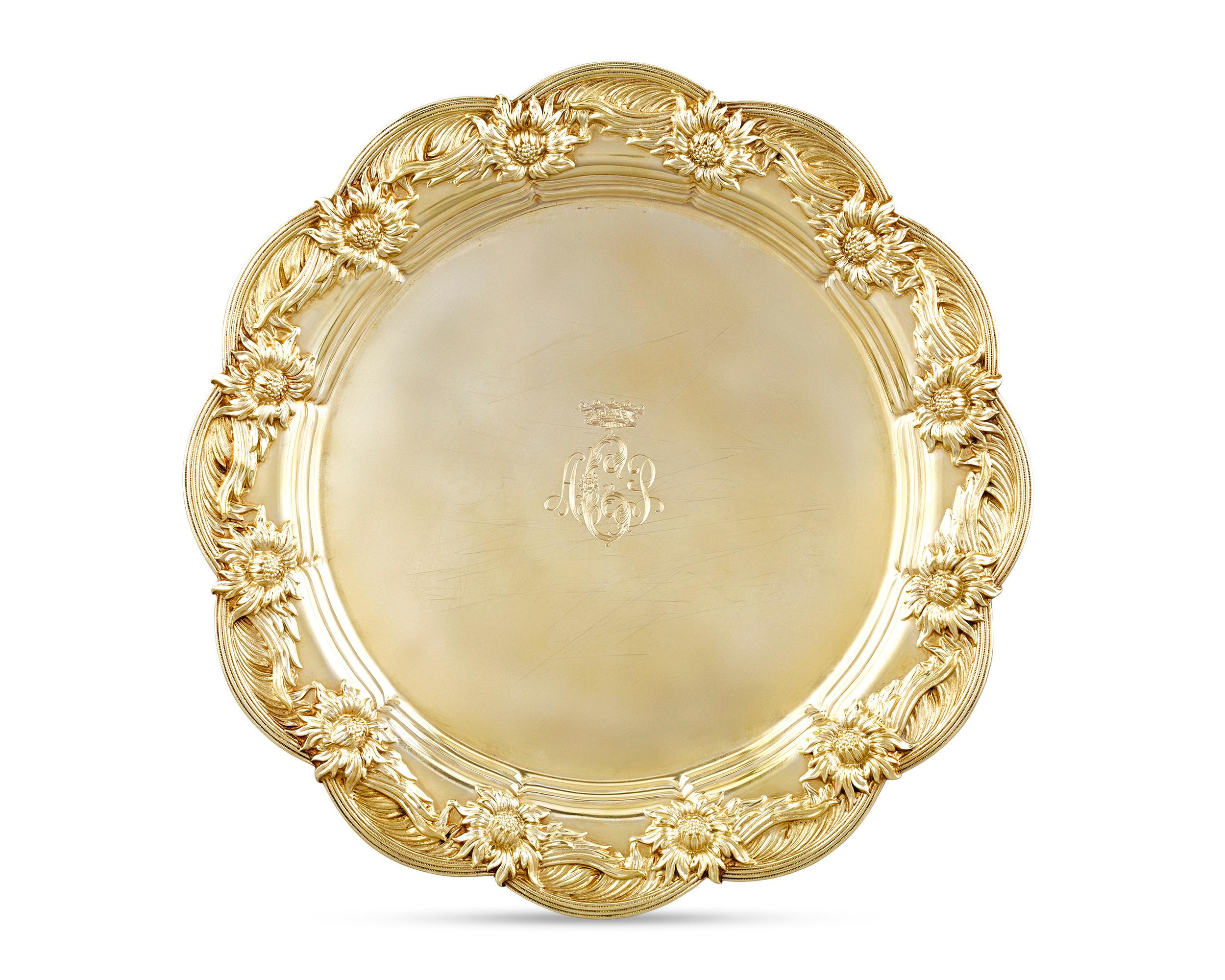 Royal provenance and luxurious gilding elevate the rarity and beauty of this service of eight Tiffany & Co. sterling silver-gilt dinner plates in the firm's beloved Chrysanthemum pattern. Commissioned for a member of European nobility, each plate