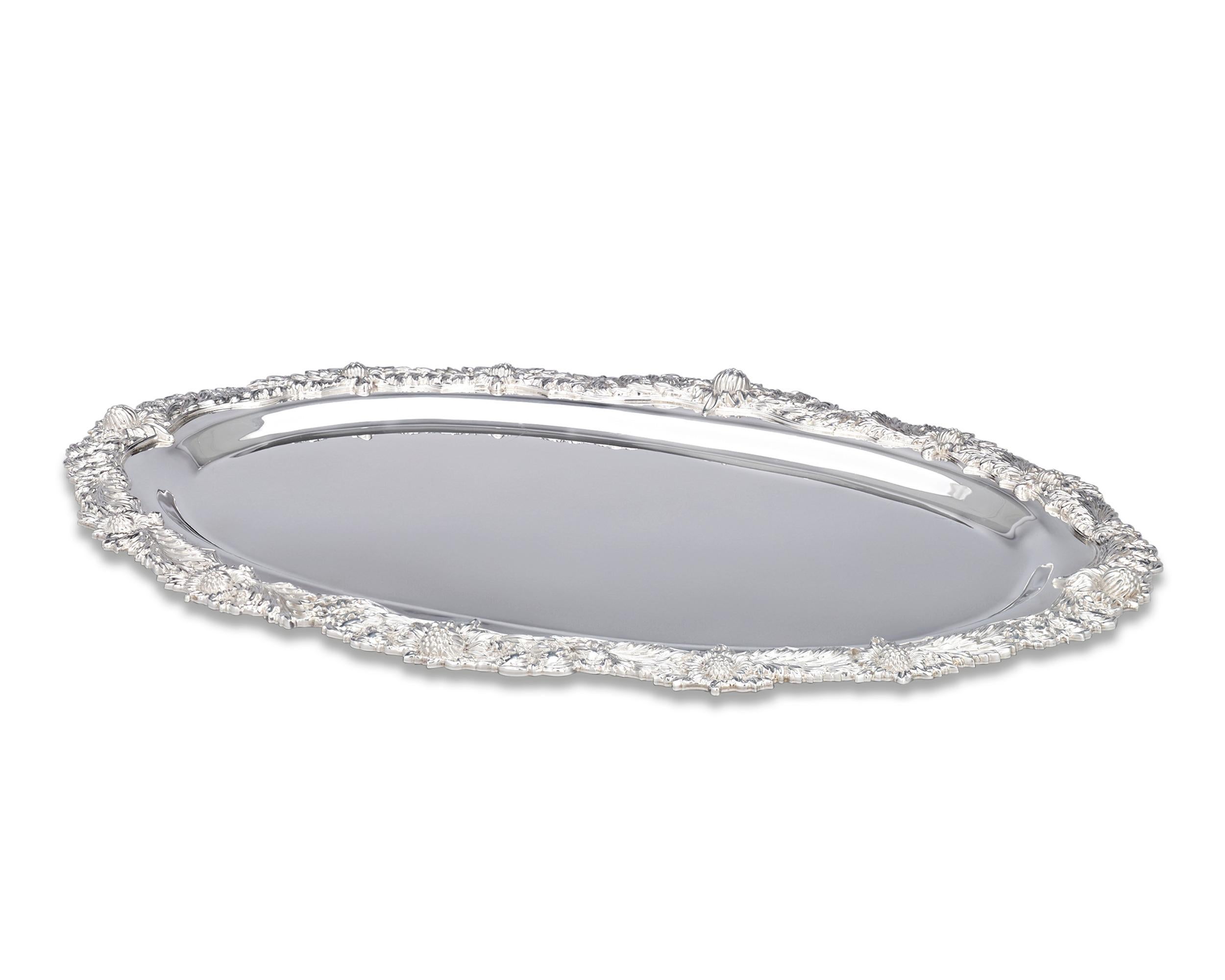Masterfully executed in the highly popular Chrysanthemum pattern, this elegant dish exemplifies the unmistakable artistry of Tiffany & Co. silver. An elaborate border of chrysanthemum blooms encircles the Classic design, which displays a remarkable