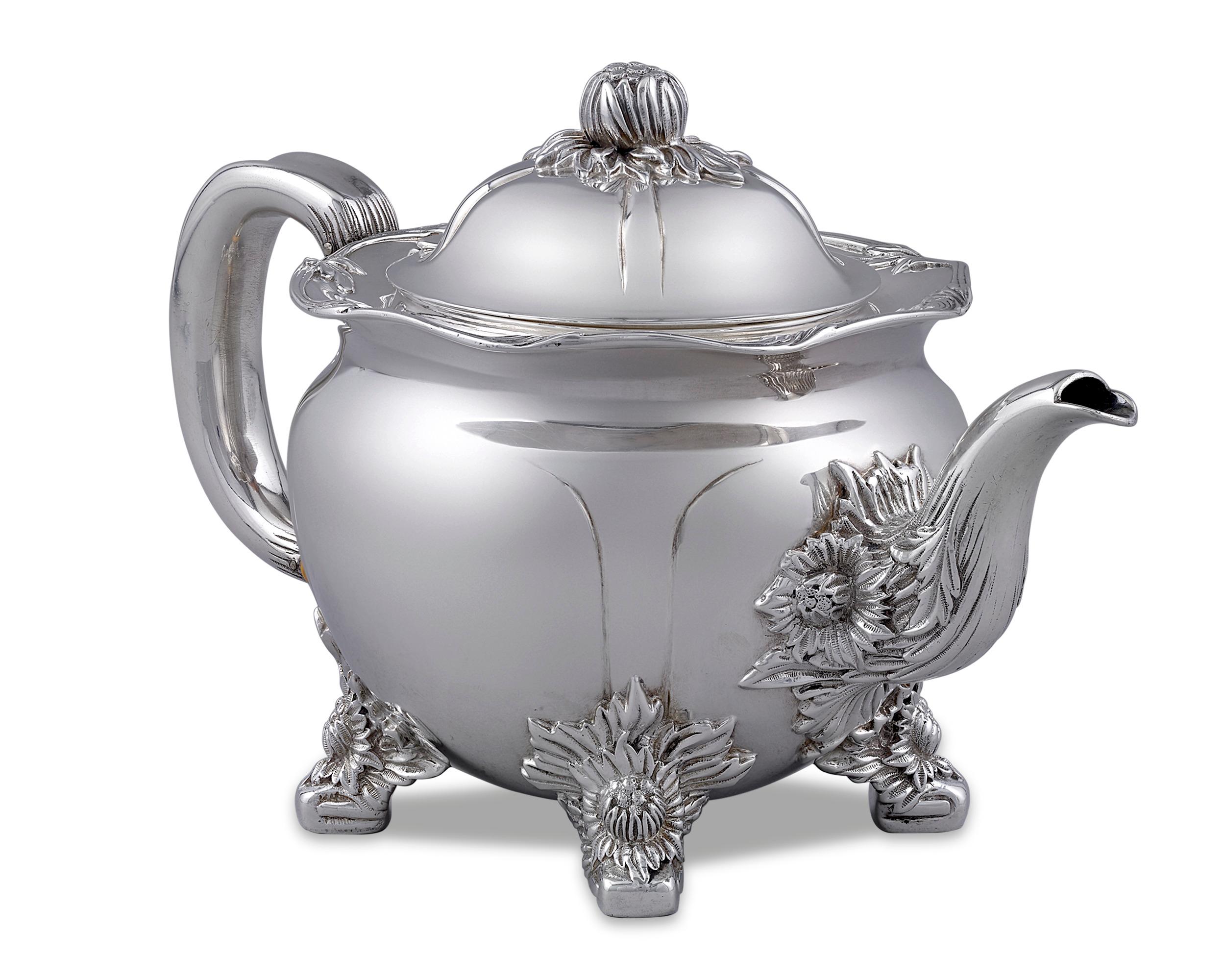 This rare three-piece sterling silver tea service by Tiffany & Co. is beautifully crafted in the popular Chrysanthemum pattern. Comprised of a teapot, sugar bowl and creamer, the set’s elaborate floral motif creates a design of graceful elegance.