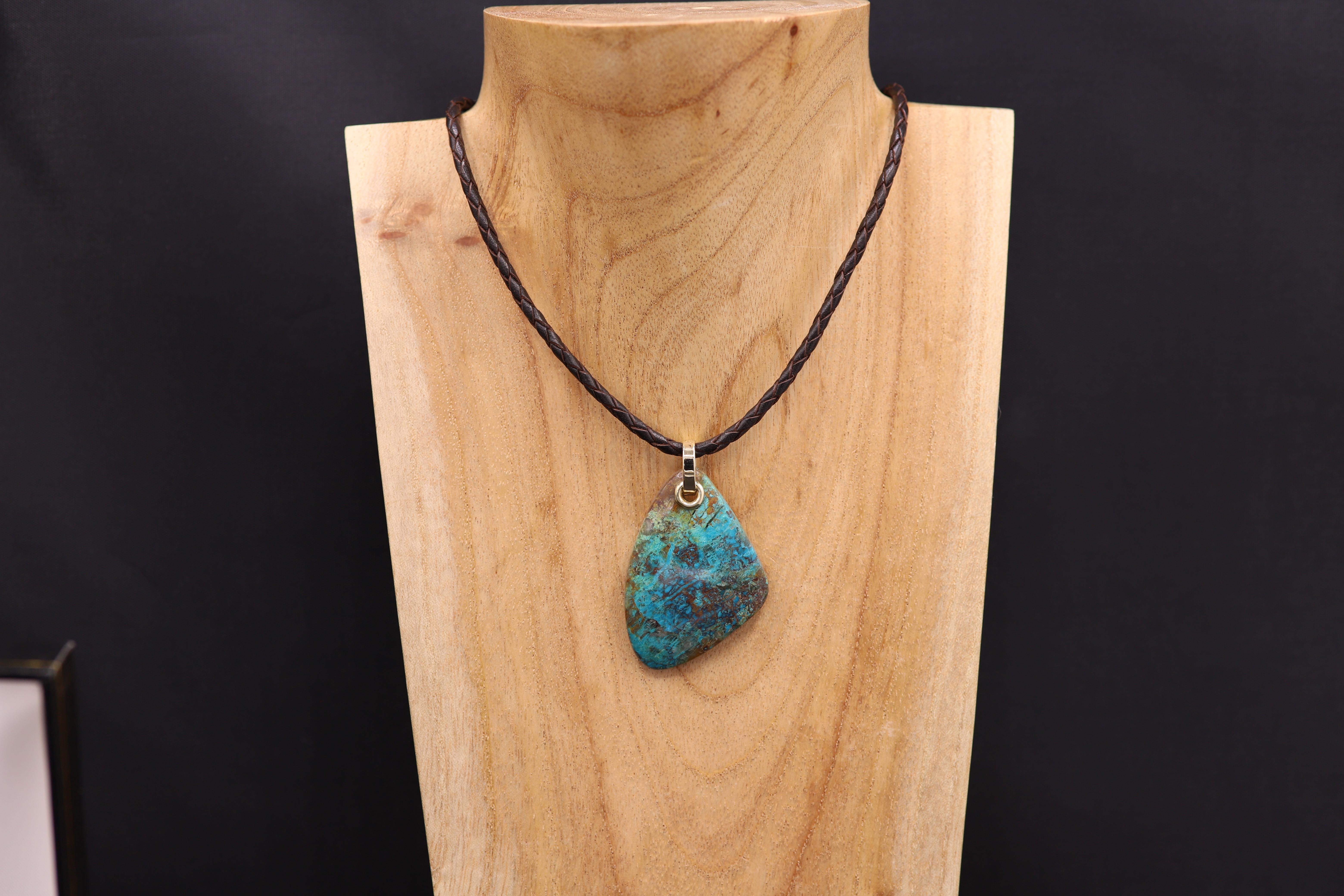 Brilliant One-of-a kind- natural Beautiful Chrysocolla stone Necklace.
all parts are 14k Yellow Gold and Italian-made leather cord.
Adjustable length 16.5' - 18.5' inch and all sizes in between, cord is dark brown.
Chryscolla stone is approx 1.75' x