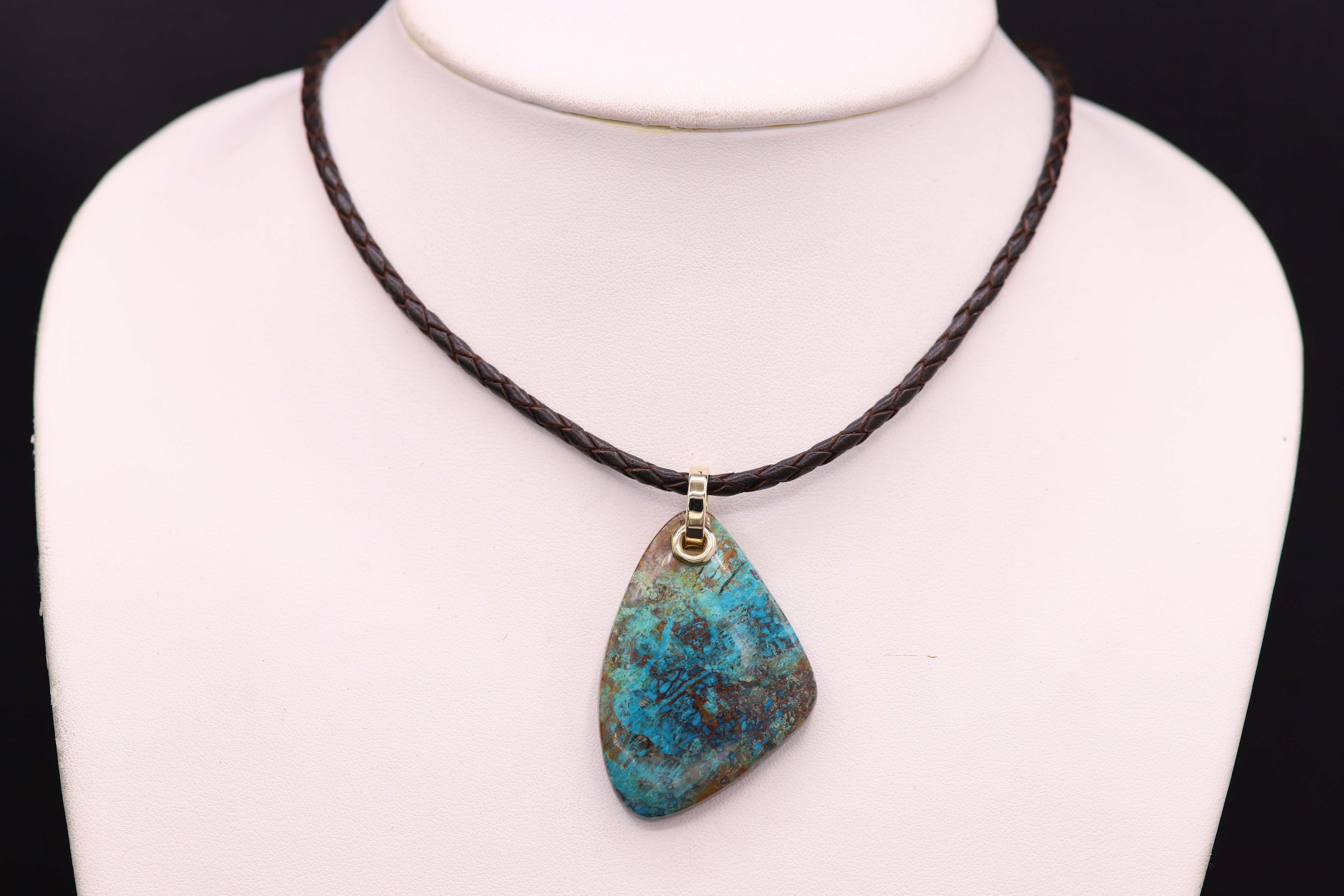 gold necklace with blue stone