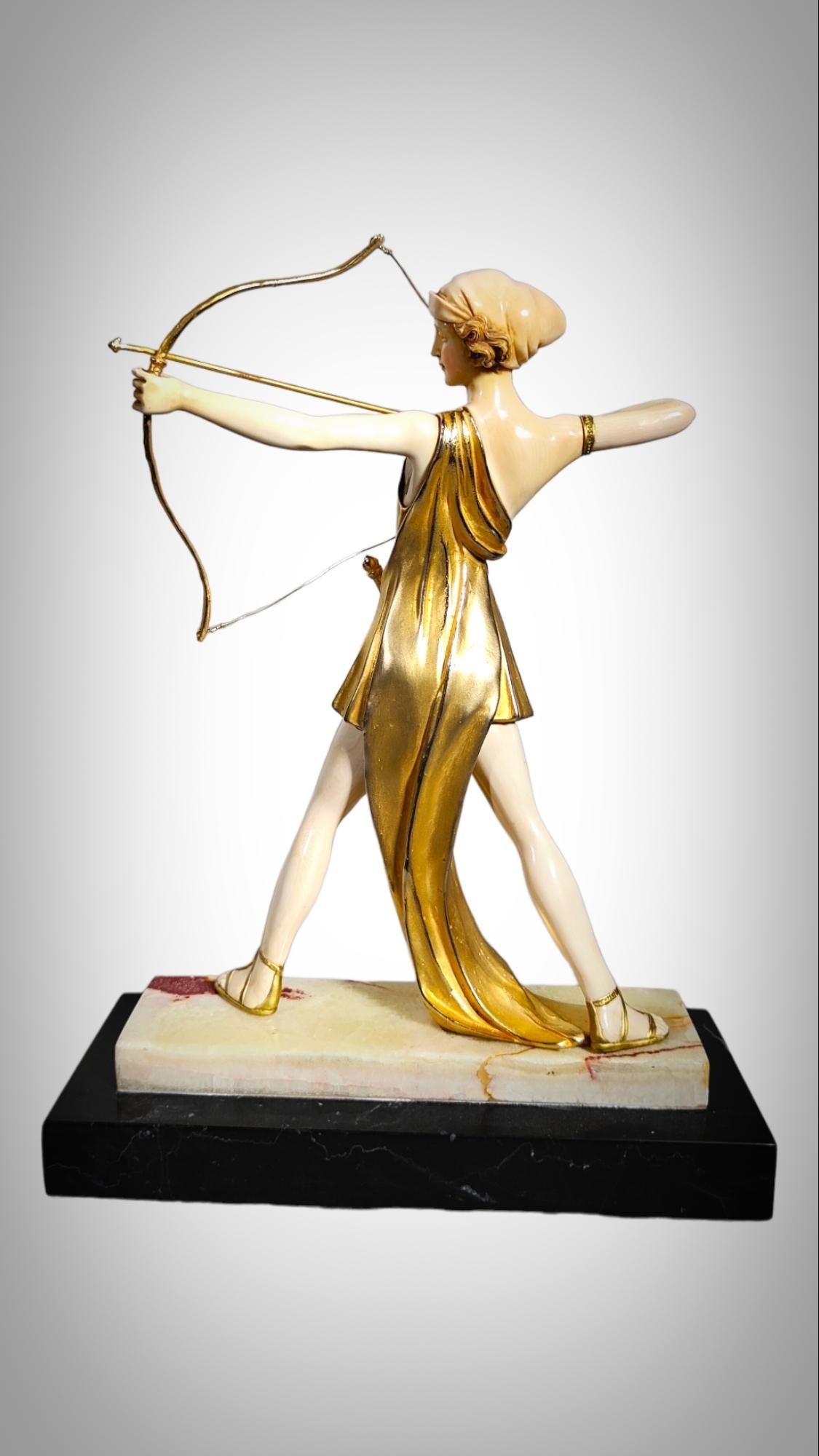 Early 20th Century Chryselephantine sculpture, gilded bronze  resting on an onyx base, Diana For Sale