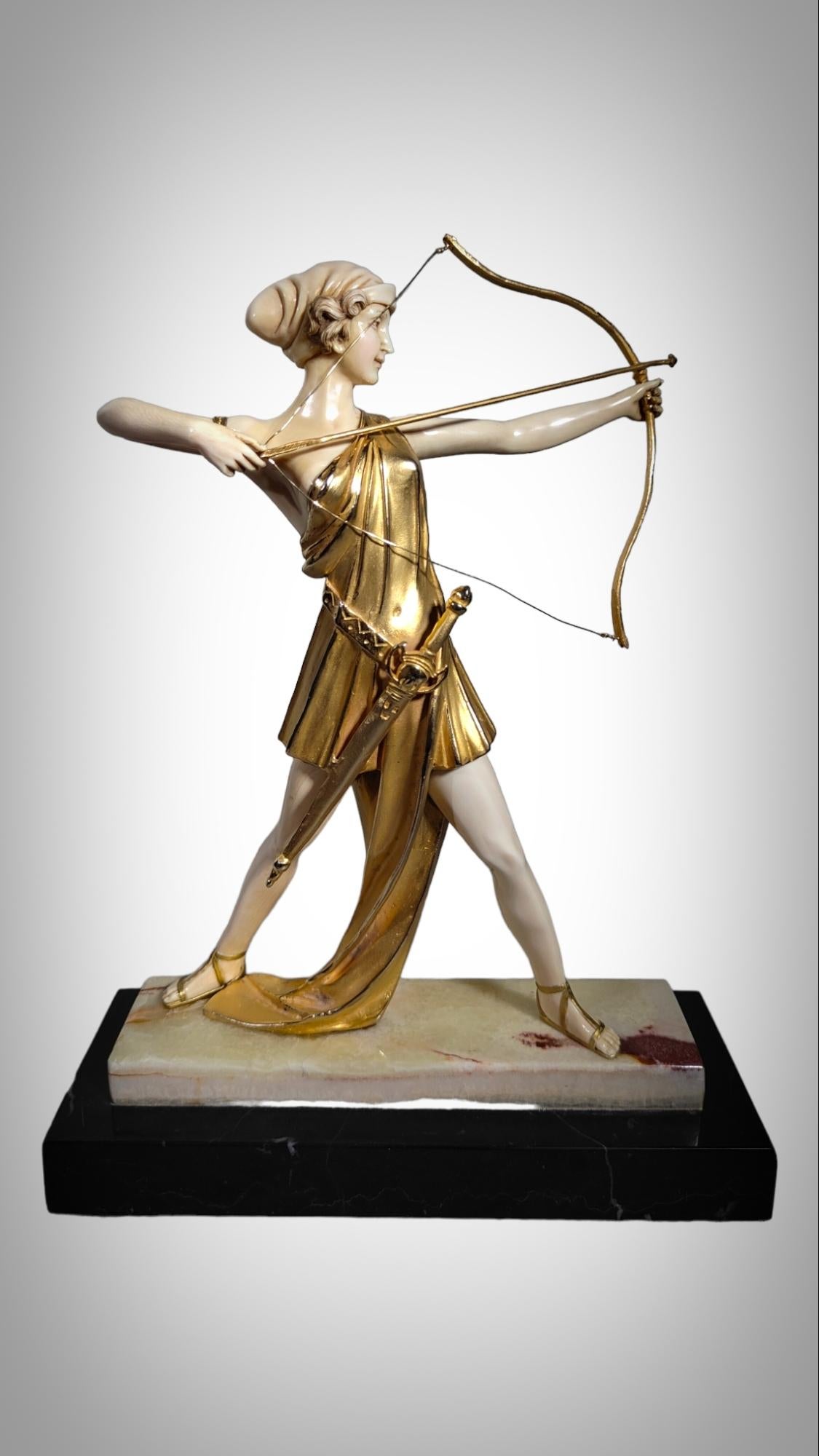 Bronze Chryselephantine sculpture, gilded bronze  resting on an onyx base, Diana For Sale
