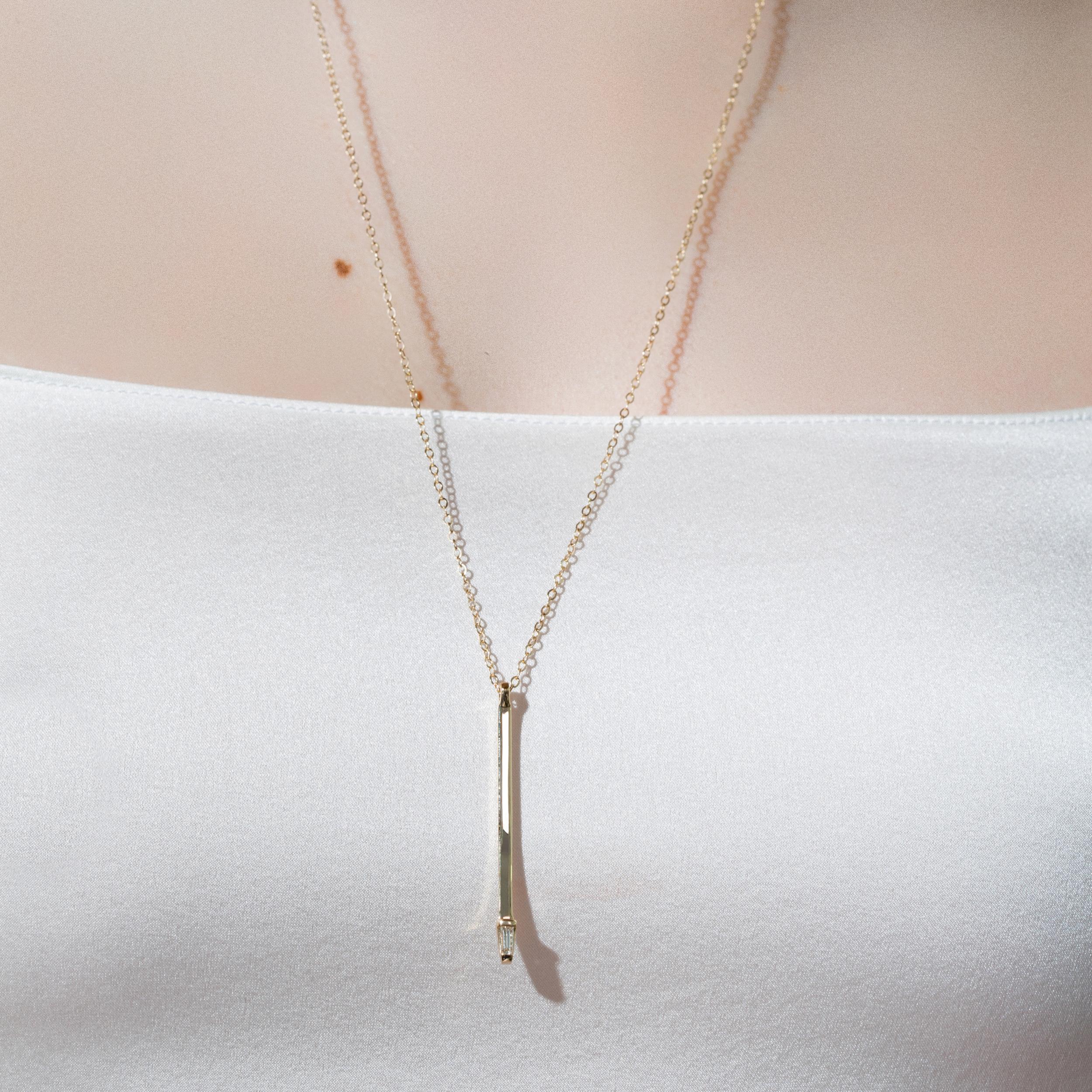 The Landmark Series celebrates love in NYC. Inspired by the structural boldness of iconic New York architecture, the collection captures the essence of Gotham. An everyday staple this necklace features one single tapered baguette designed with the