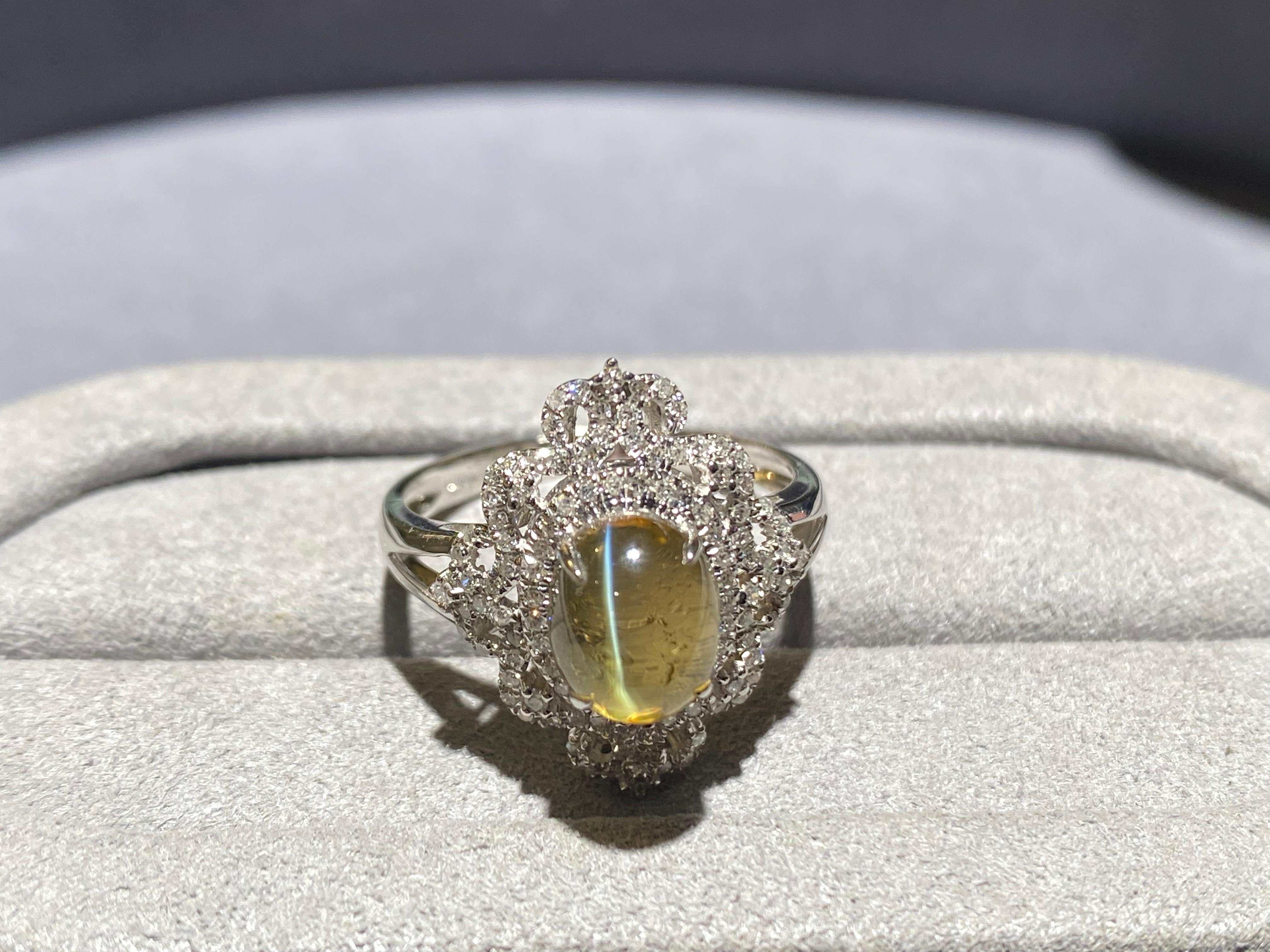 Contemporary Chrysoberyl Cat's Eye and Diamond Ring in 18k White Gold For Sale